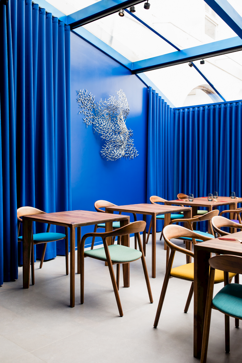 Multiple views of Neva Chair highlighting elegant curves and ergonomic form