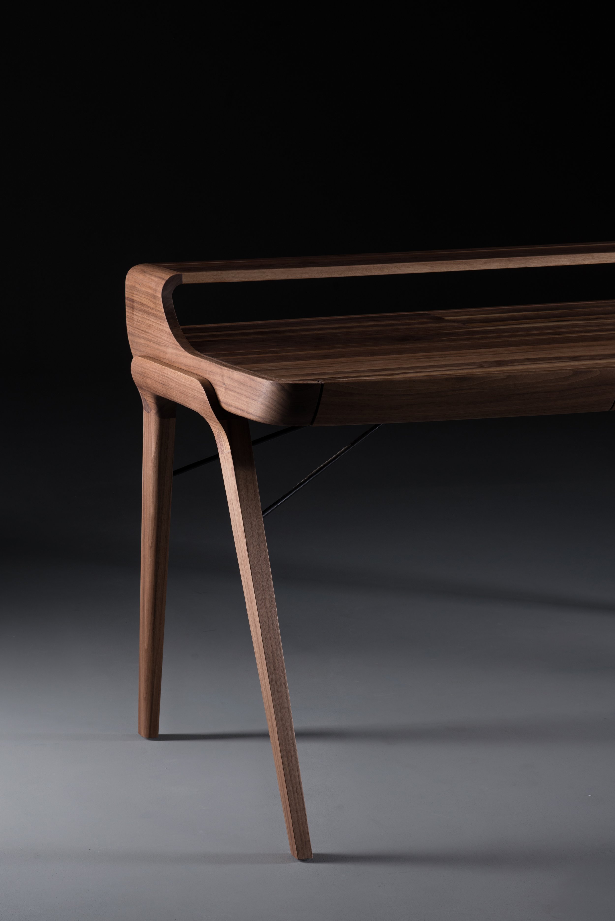 Picard Desk with soft-edged wooden body and elegant lateral legs