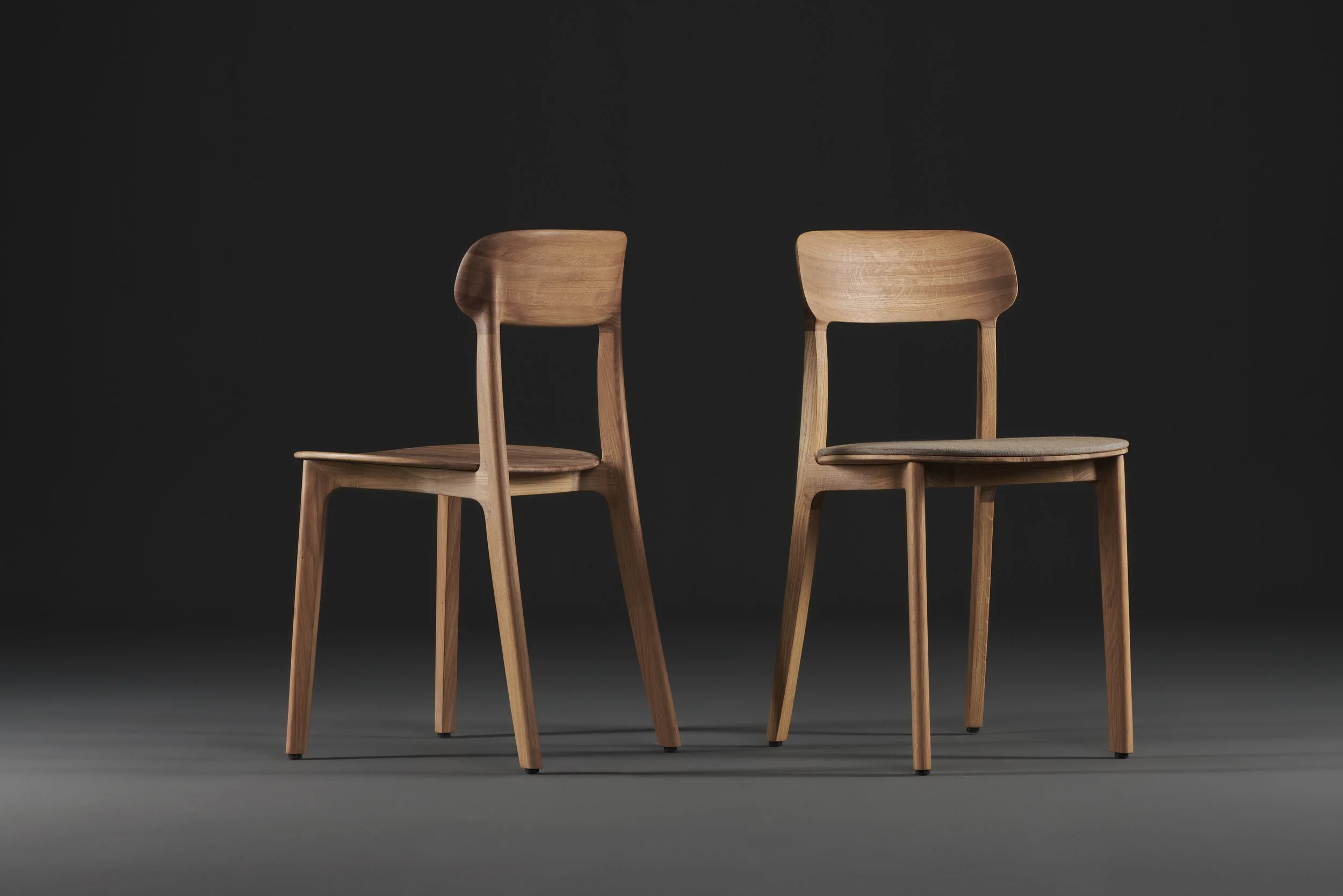 Tanka Chair with elegant curved wooden back legs