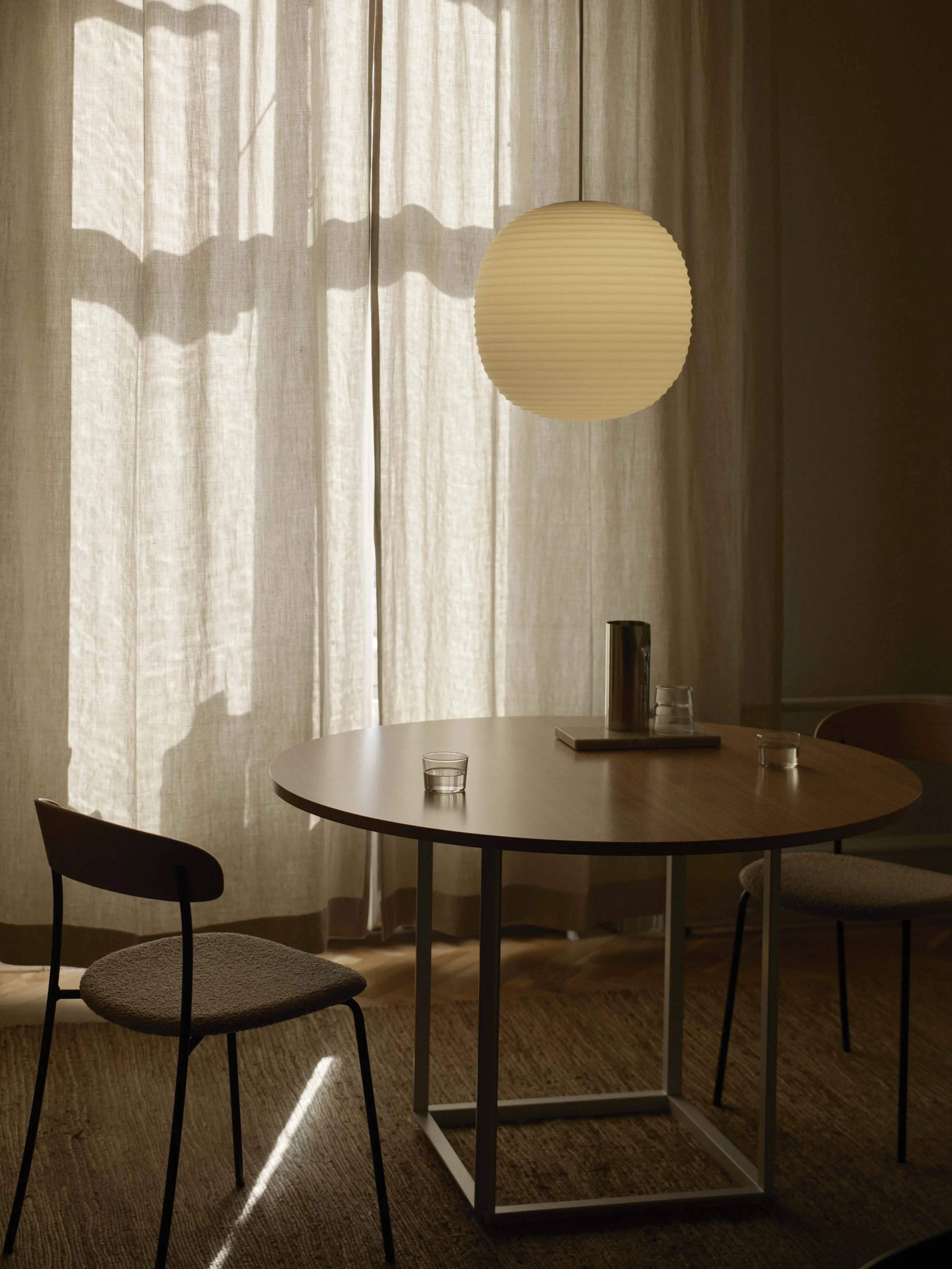 Detail of Missing Chair emphasizing the delicate curves of the seat and backrest framed by simple linear legs, creating a minimalist, sketch-like appearance