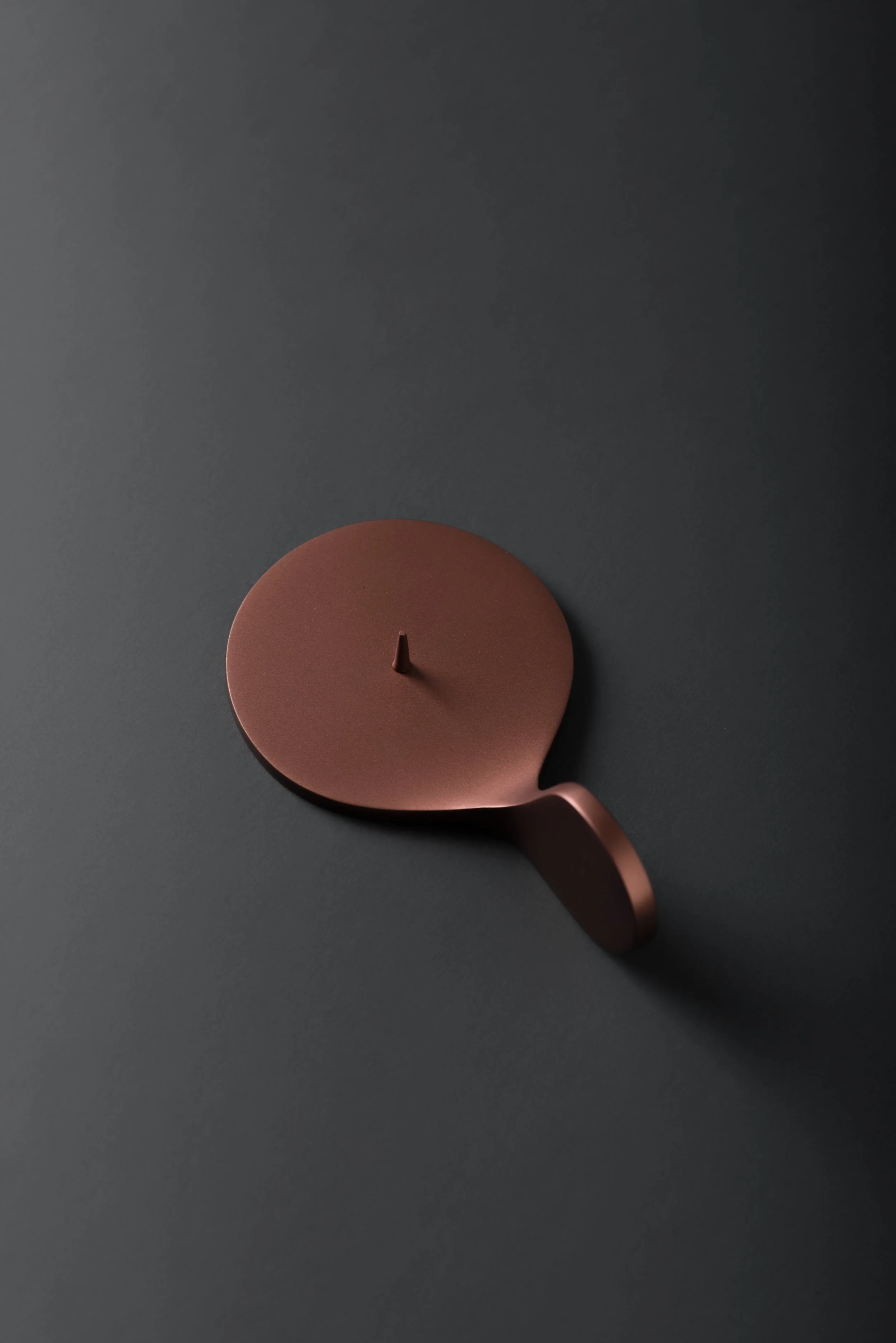 Detail of metal candleholder showing refined craftsmanship