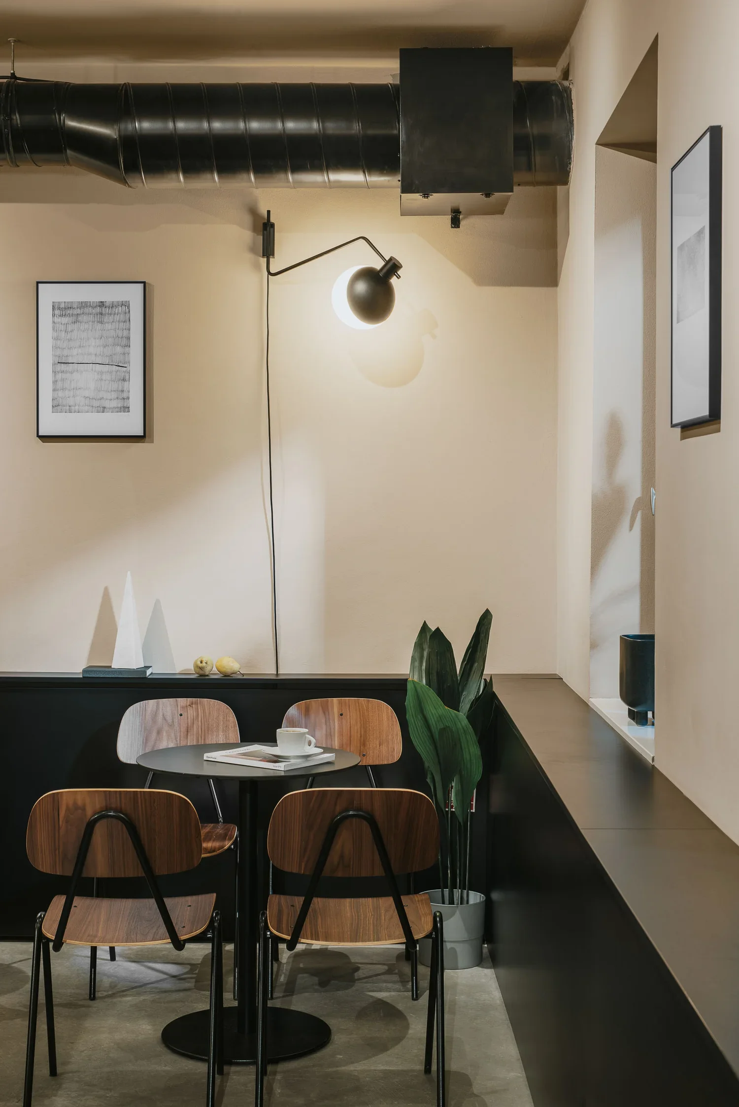 Minimalist café-bar-gallery hybrid space in Zagreb
