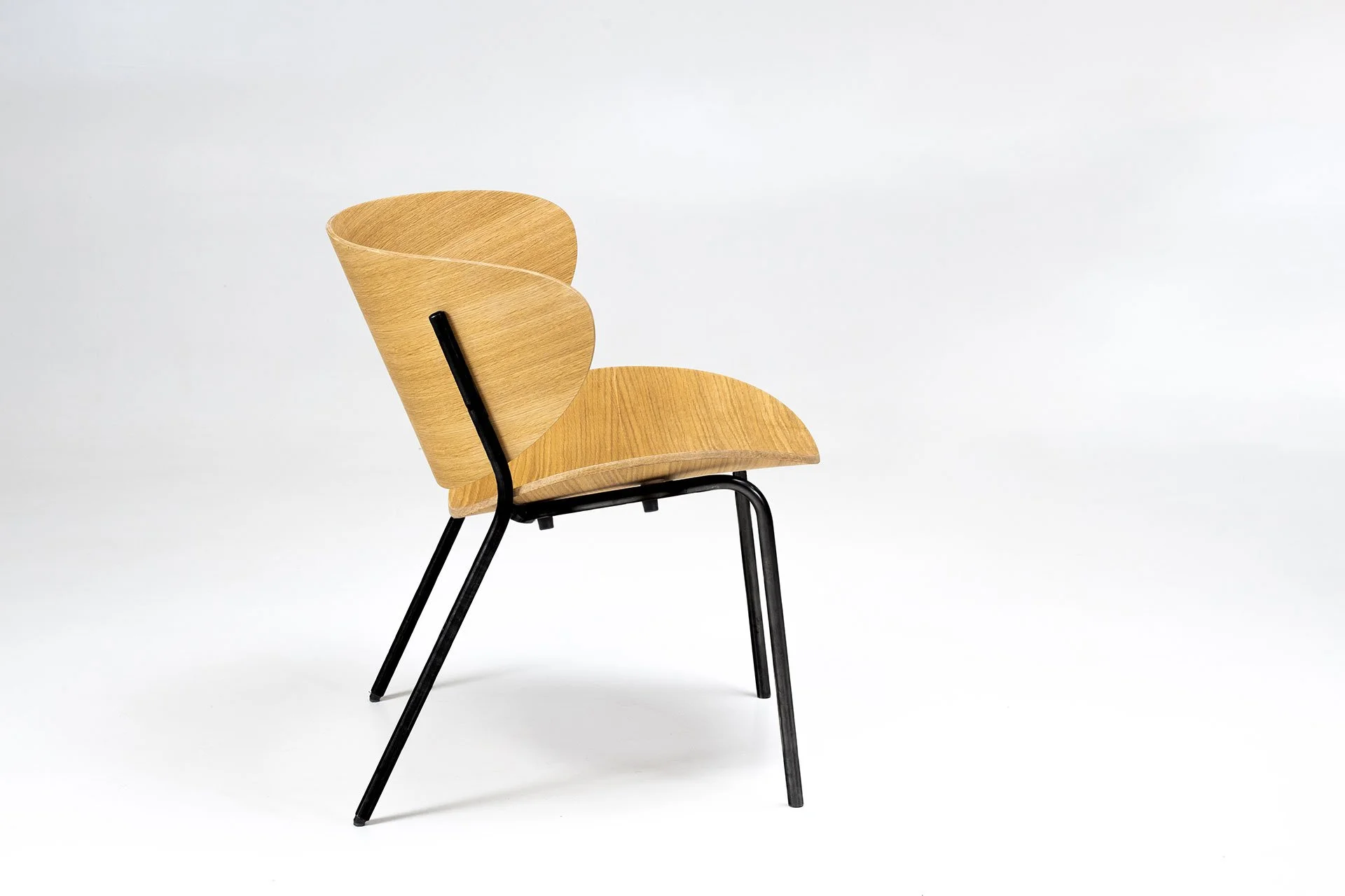Bolta collection chair showcasing fluid, human-centered geometry