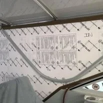 A view of a Robie Canvas custom makrolon window replacement on a large cruiser side window.