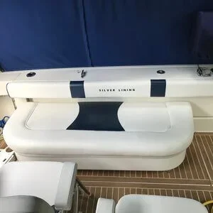 A custom Robie Canvas cushion reupholstery with unique pattern designs and custom lettering per the customer request.