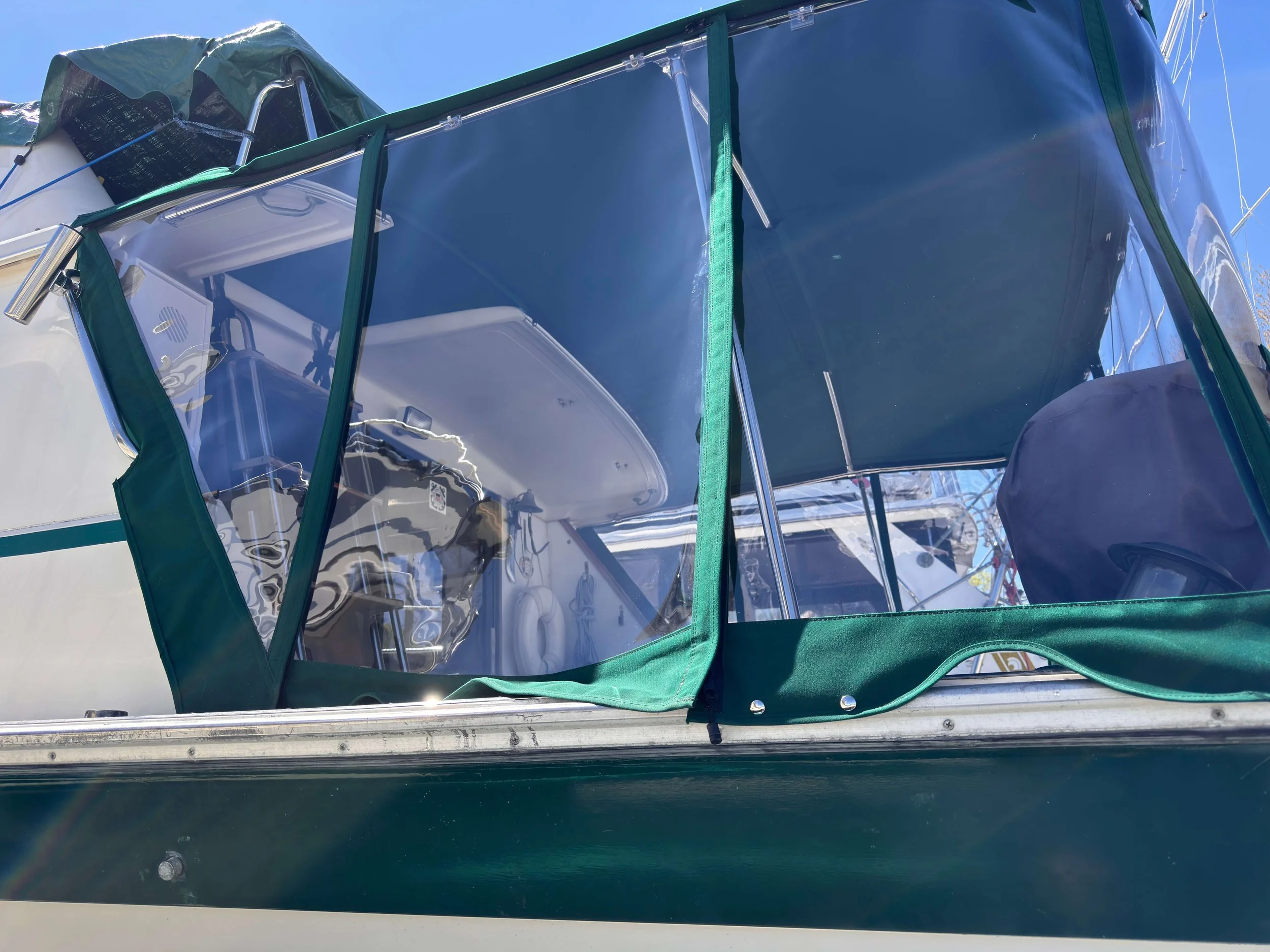 Robie Marine Custom Frame Bimini and Enclosure using Sunbrella and Strataglass.jpeg