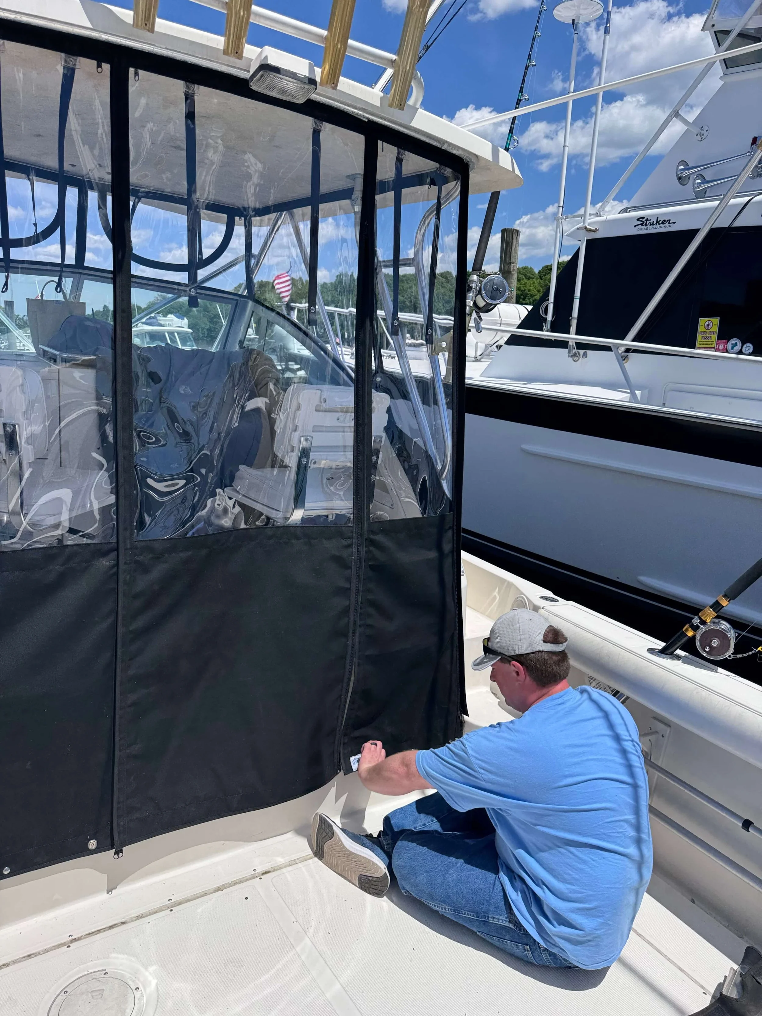 Robie Staff installing the final snaps on rear enclosure panels.jpeg