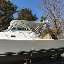 A white Mainship Pilot 30 that just had it's enclosure installed by Robie Canvas.