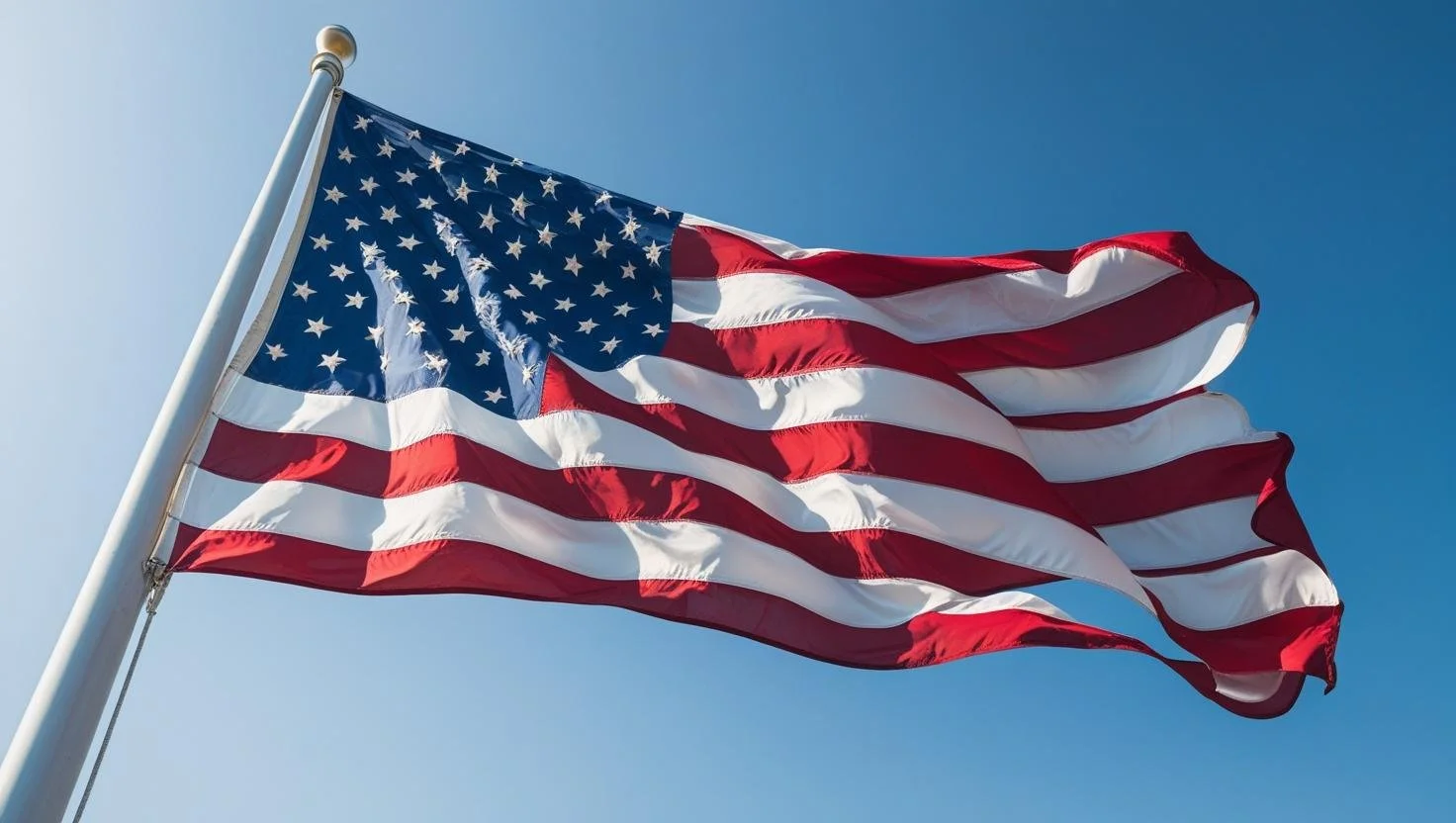 A U.S. flag proudly waving in the wind