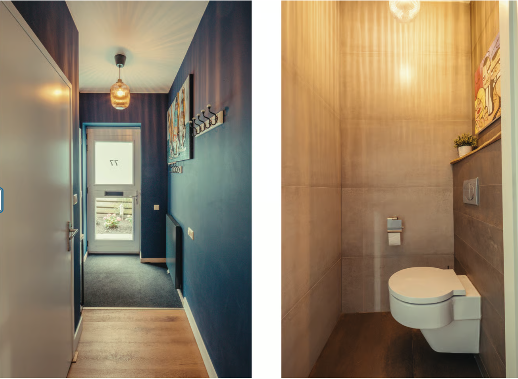 Modern toilet met grote beige tegels en een kleine plant.