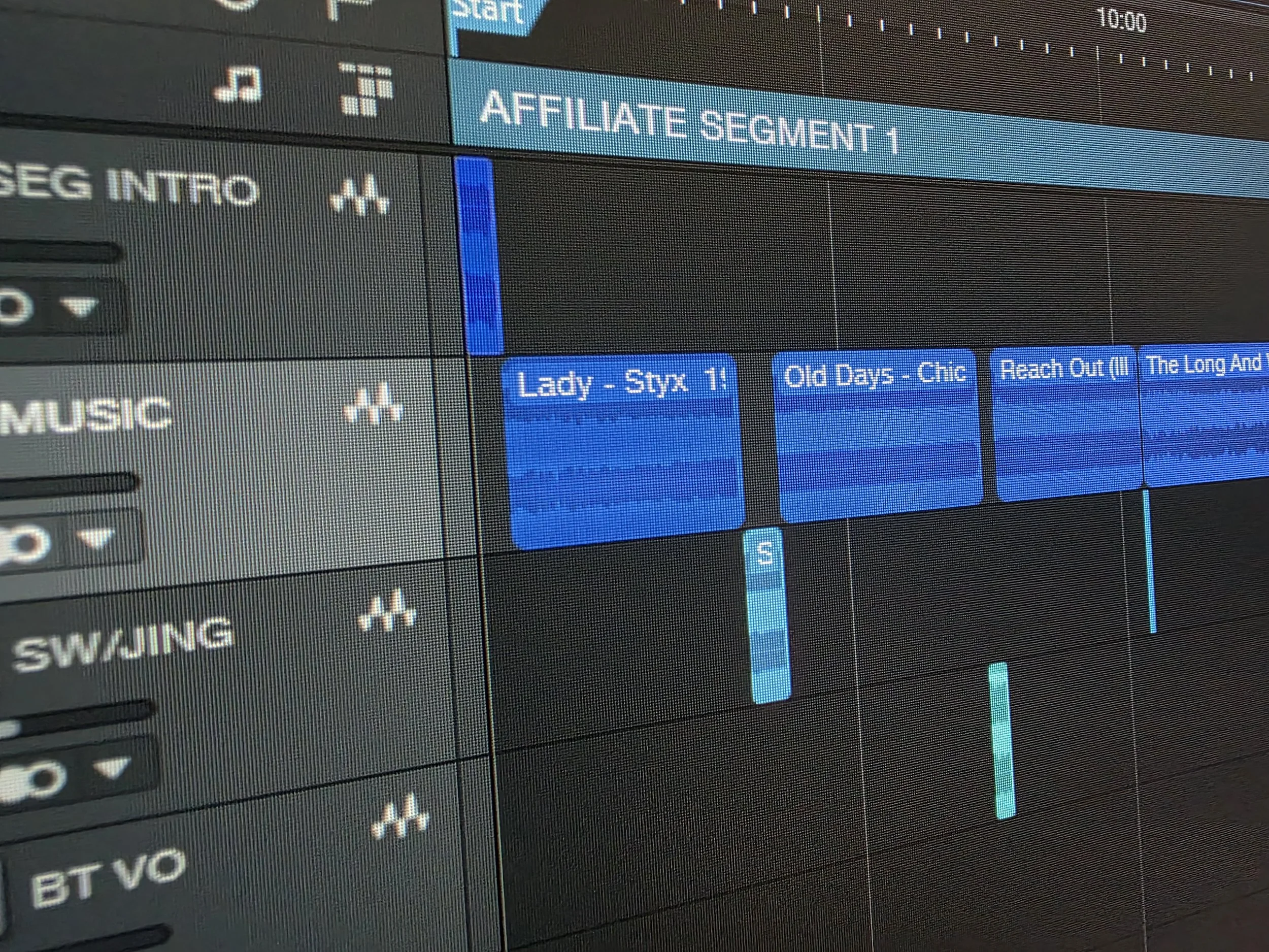 A computer screen showing a music production software with multiple tracks labeled 'Lady - Styx 1', 'Old Days - Chic', 'Reach Out', and 'The Long And Winding Road' among others.