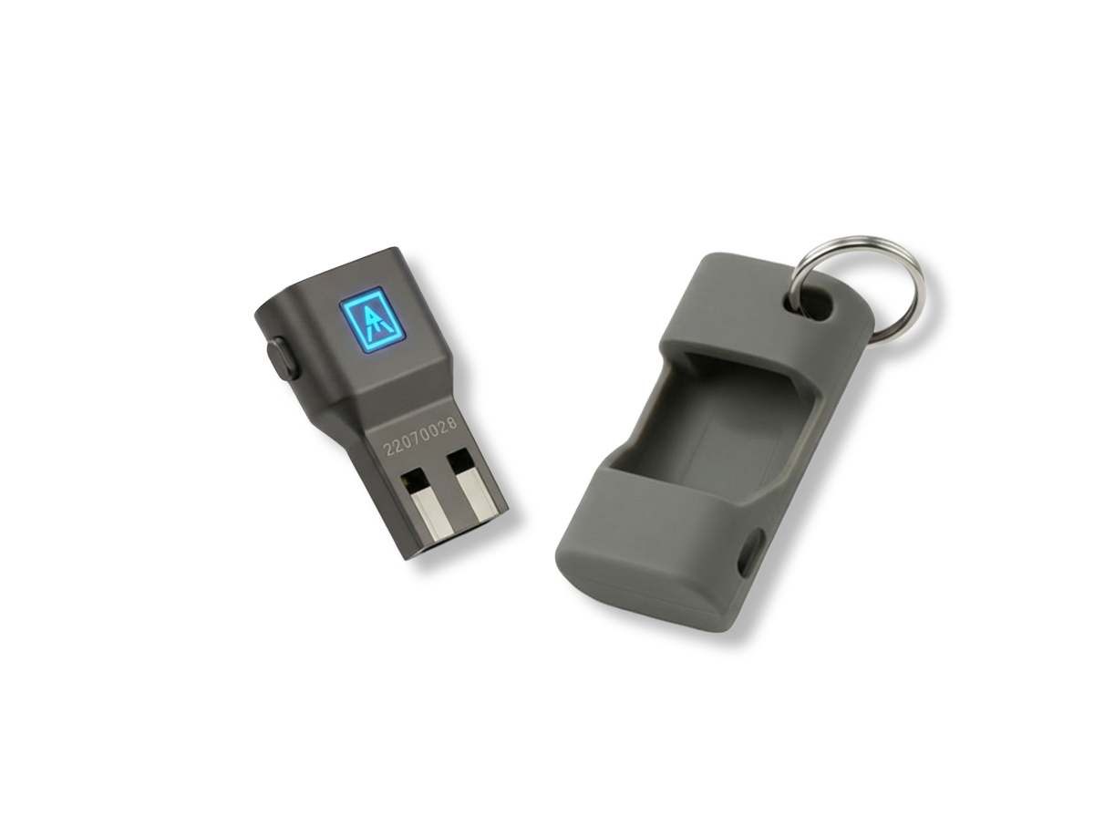 A portable electronic device with a small screen displaying a blue lit icon and a separate gray plastic case with a keyring.