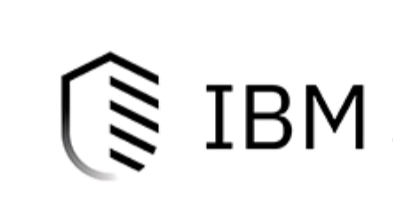 Close-up of the IBM logo on a black speaker, with a focus on the logo, in black and white.