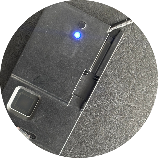 Close-up of an ATKey.Badge plugged in. The LED is blue.