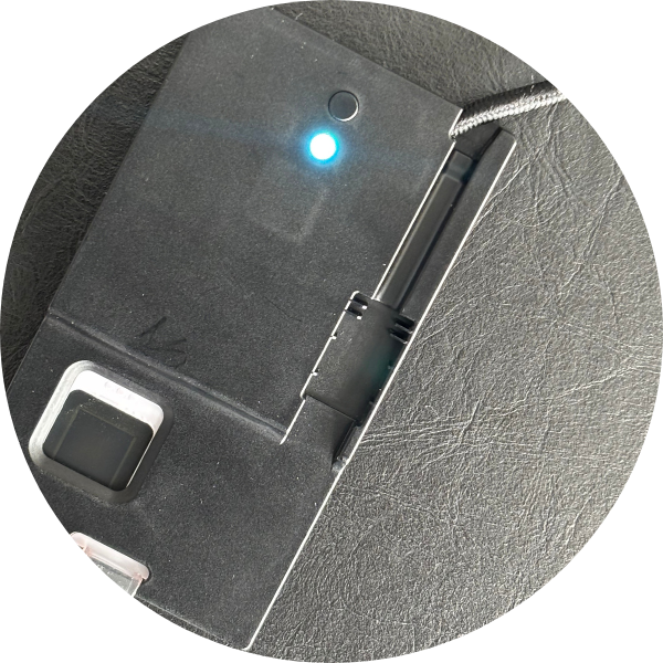 	
Close-up of an ATKey.Badge plugged in. The LED is cyan.