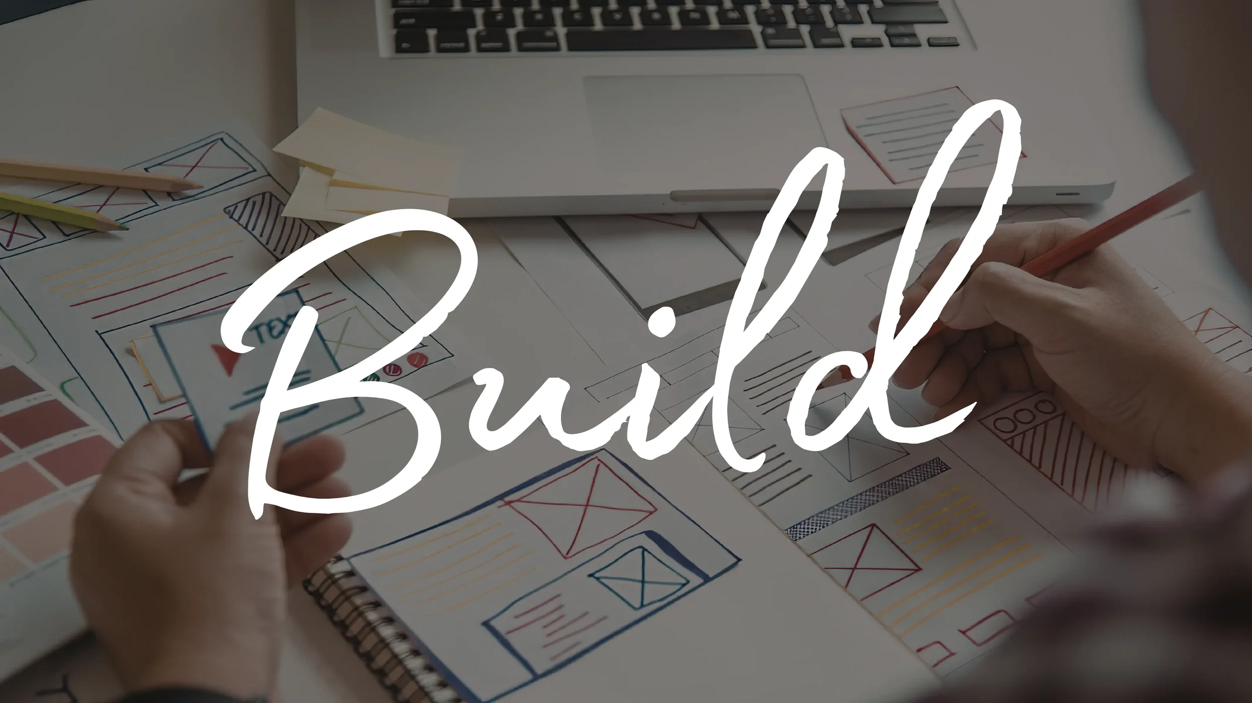Design sketches, color swatches, and notes on a desk with a laptop, with the word 'Build' written across the image.