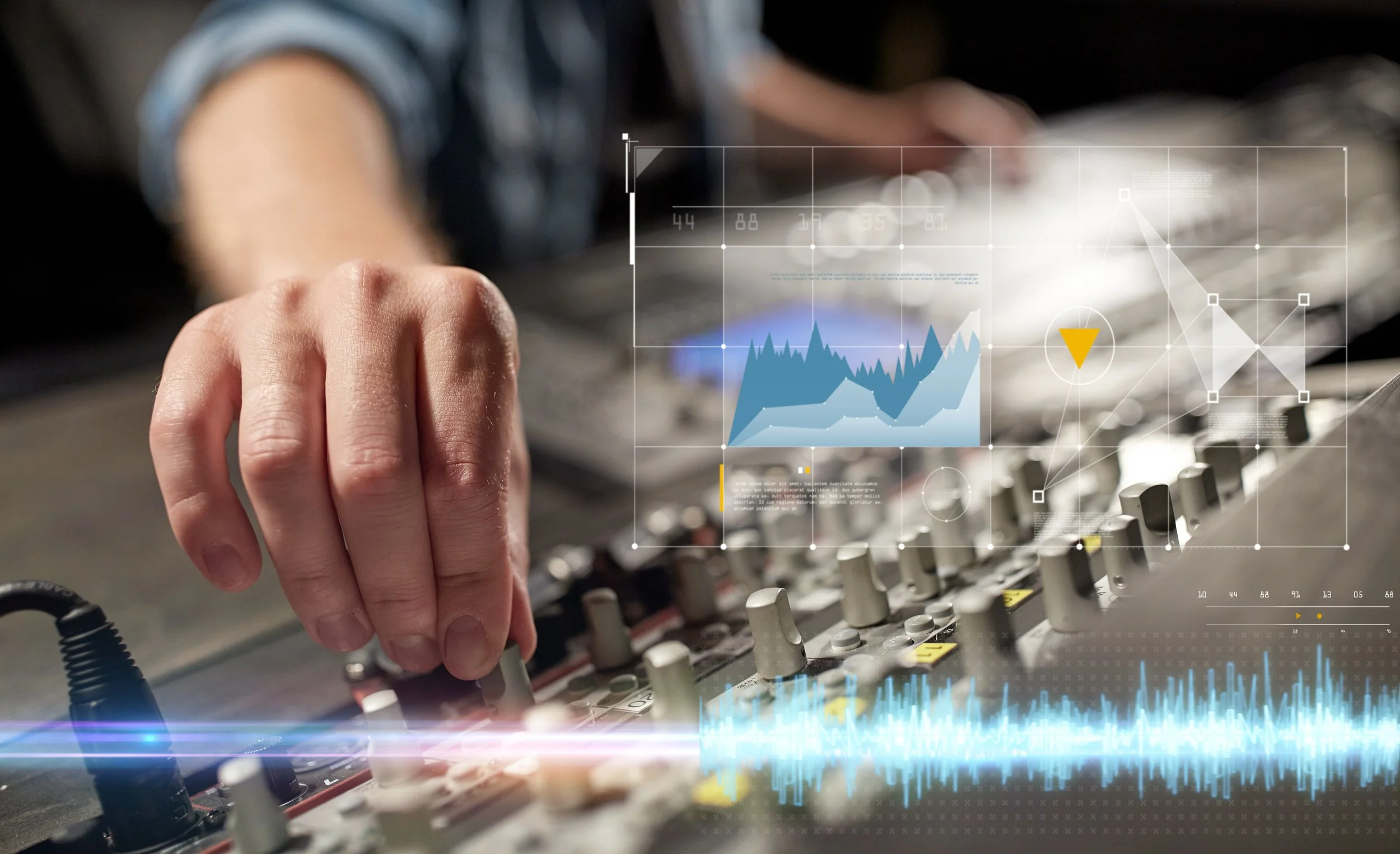 Close-up of a person's hand adjusting knobs on a sound mixing console with digital graphs and data overlays floating above.