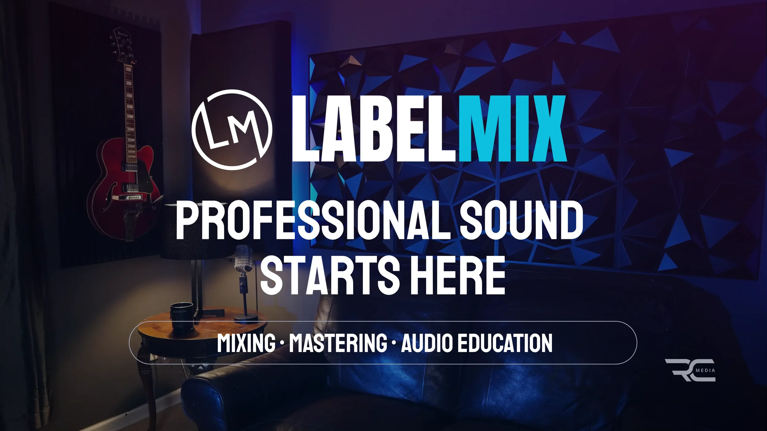 A music studio with a red electric guitar hanging on the wall, a speaker, a microphone on a stand, a wooden table with audio equipment, and a geometric wall design. The text overlay reads 'LabelMIX Professional Sound Starts Here' and mentions mixing, mastering, and audio education.