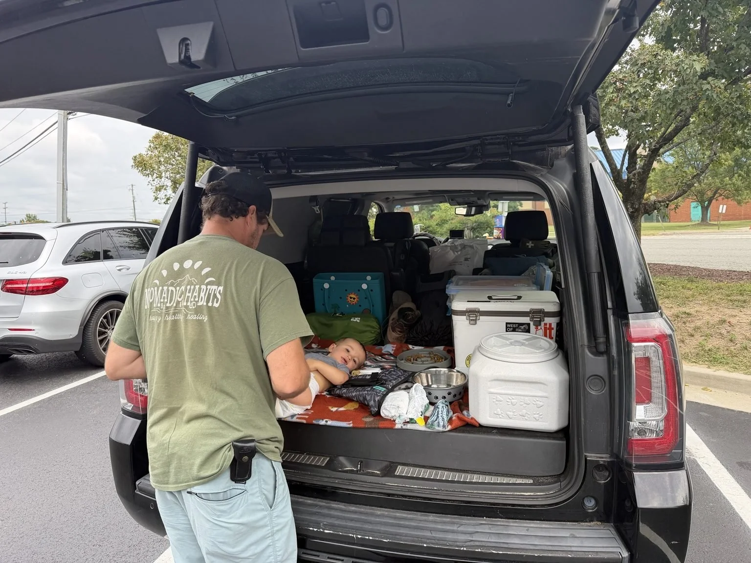 Dad changes toddlers diaper on an 8 hour road trip to Tennessee without the RV.