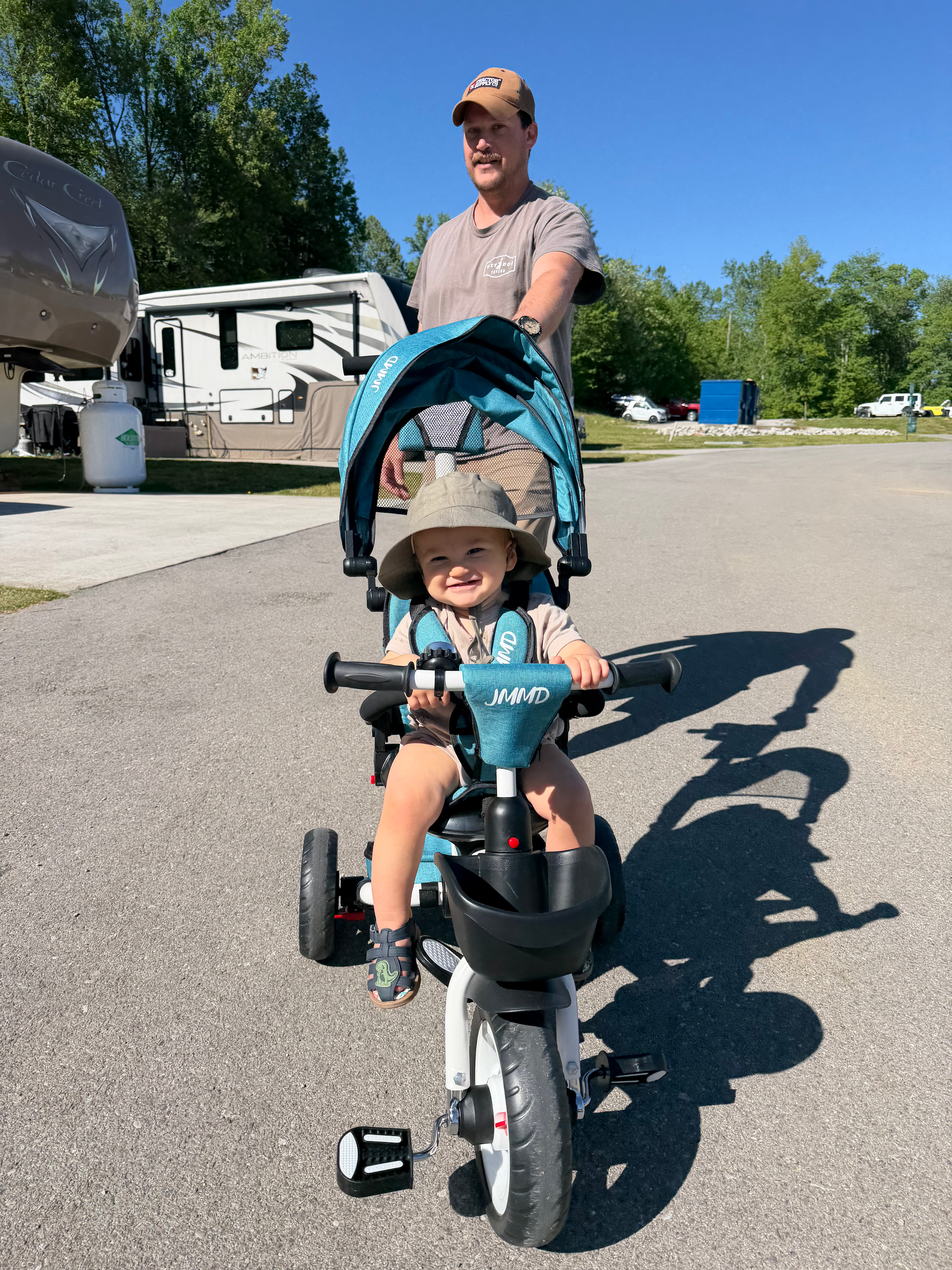Dad and toddler taking an evening walk through the campground during our year of full-time RV living in Tennessee.