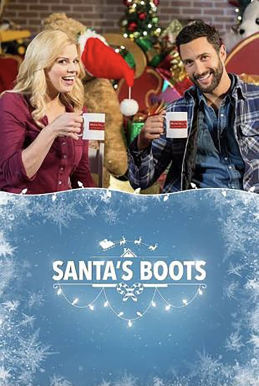 Two smiling people, a woman and a man, are sitting at a Christmas-themed setting, holding white mugs. They are surrounded by festive decorations including a Christmas tree, a reindeer plush, and holiday decor. The bottom part of the image features the text 'Santa's Boots' with a holiday-themed background of snowflakes and icy patterns.