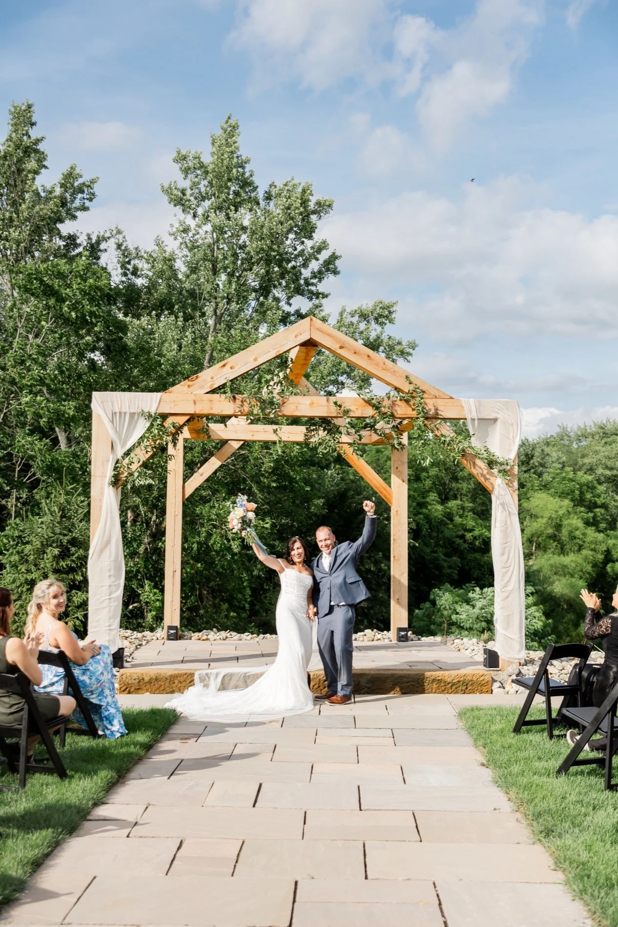 bride-groom-getting-married-outdoor-lakeside-ceremony.jpg