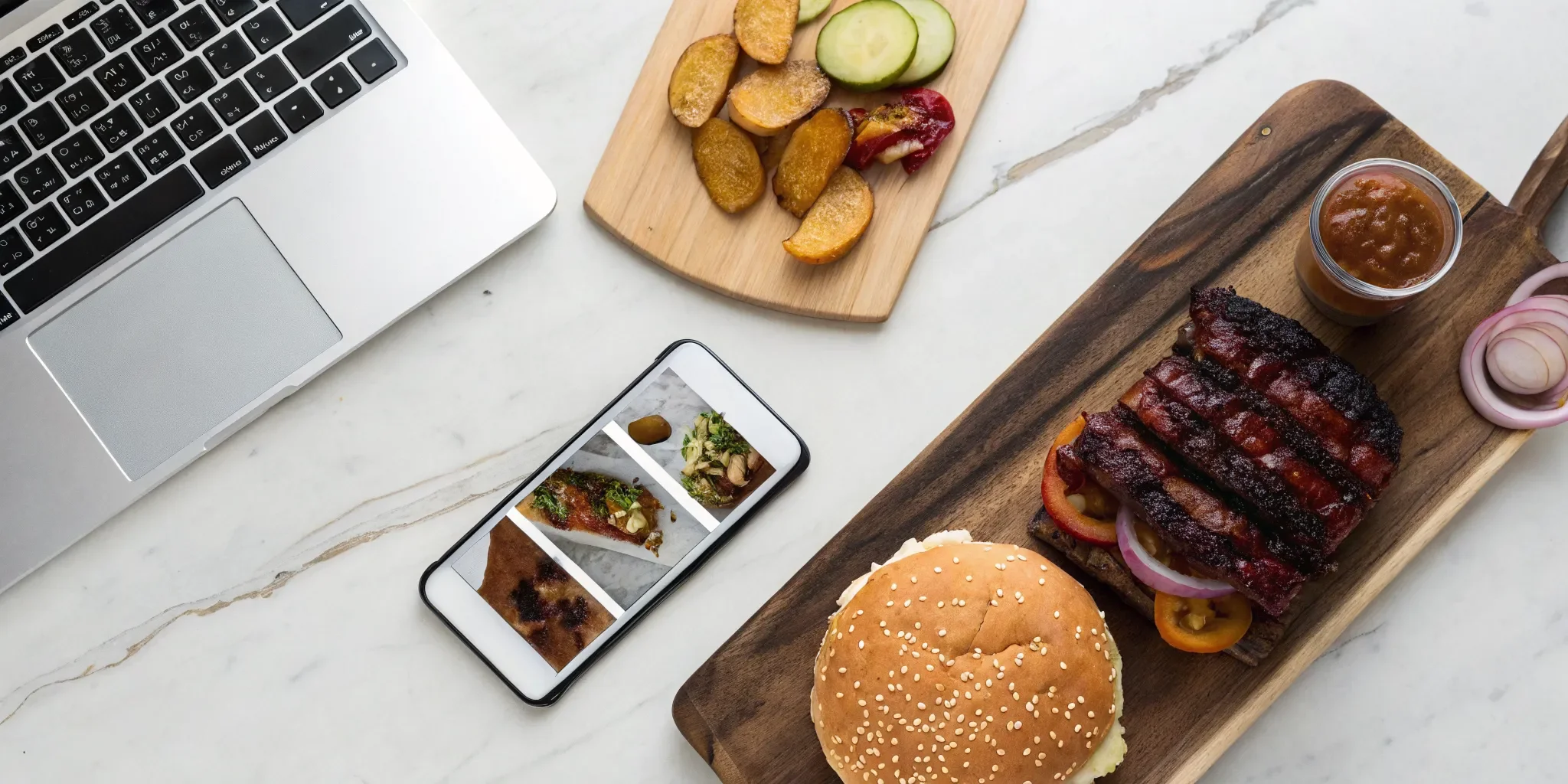 Order grill favorites online, with BBQ ribs, a burger, and sides next to a laptop.