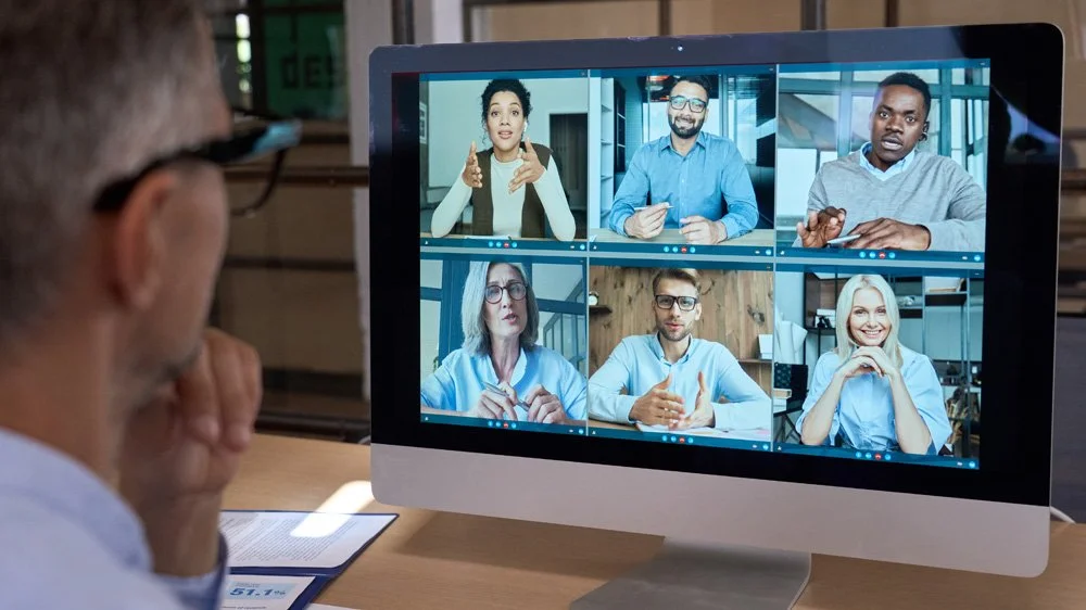 Group of people on screen in a virtual event