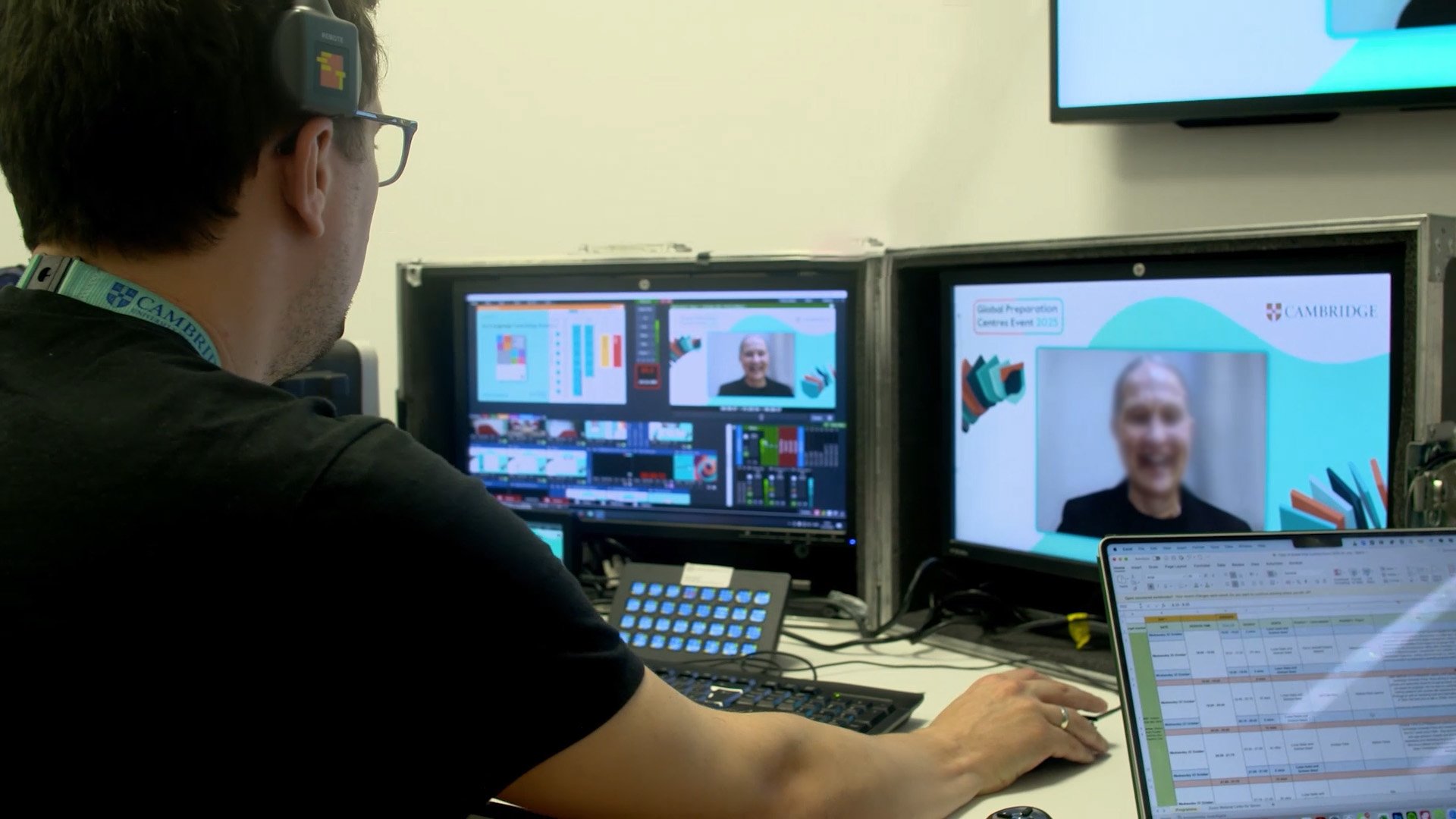 Hybrid event production operator managing cameras, audio and live streams during an event