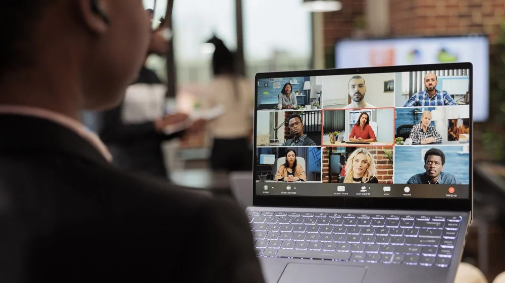 Laptop showing a virtual event on it