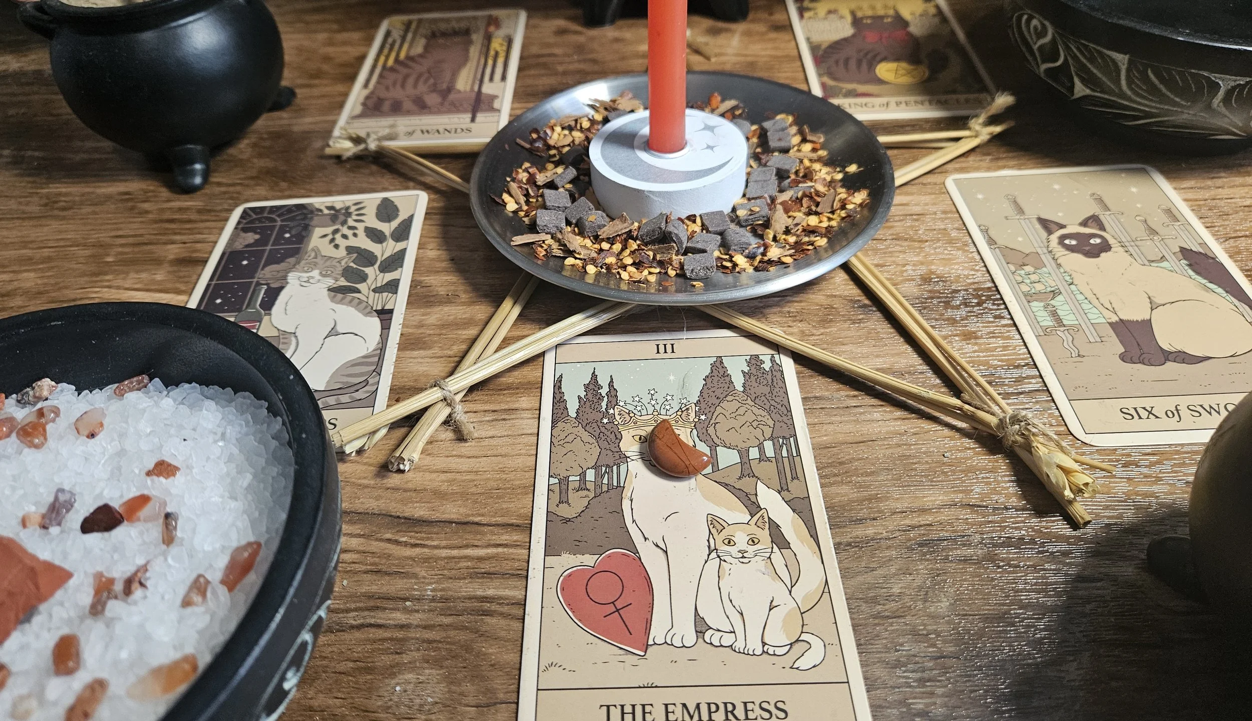 The Empress tarot card featuring a regal woman surrounded by nature, symbolizing fertility, abundance, and nurturing energy.