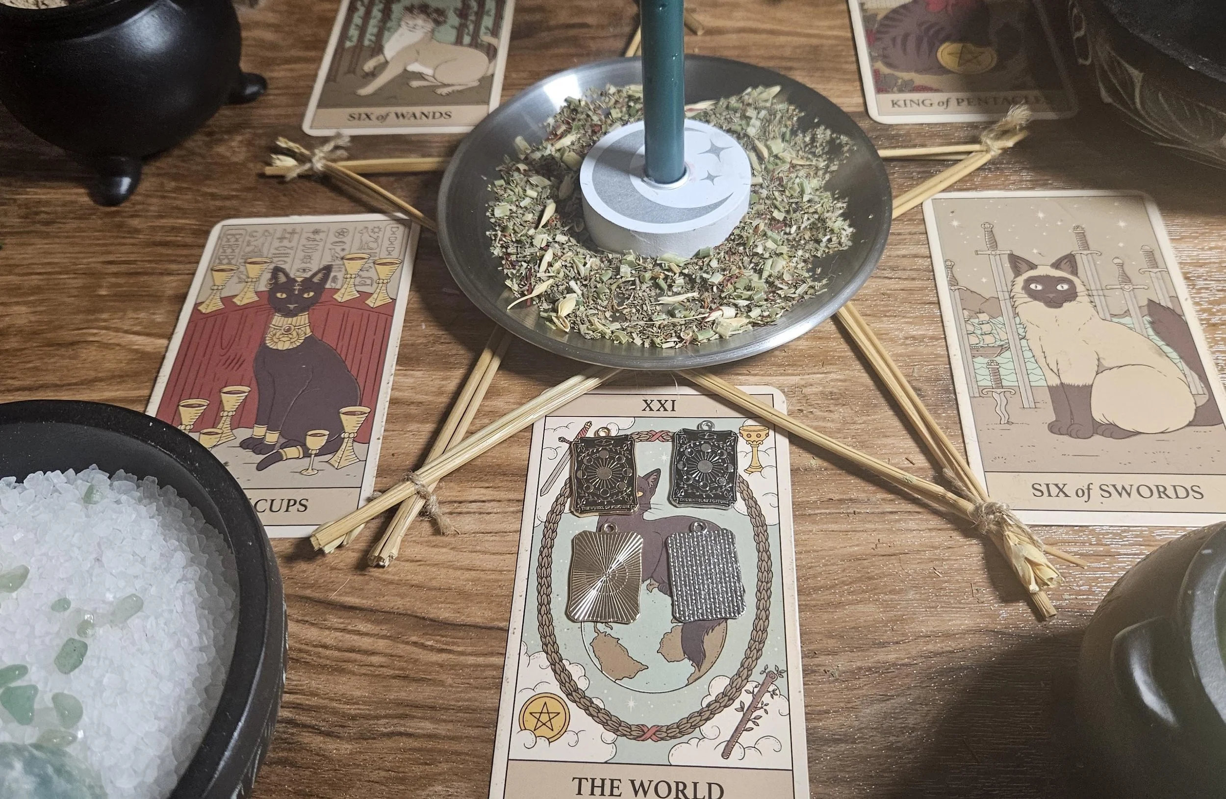 Citrine crystal pendant on an altar with beeswax candles, spices, and burning incense. (Copy)