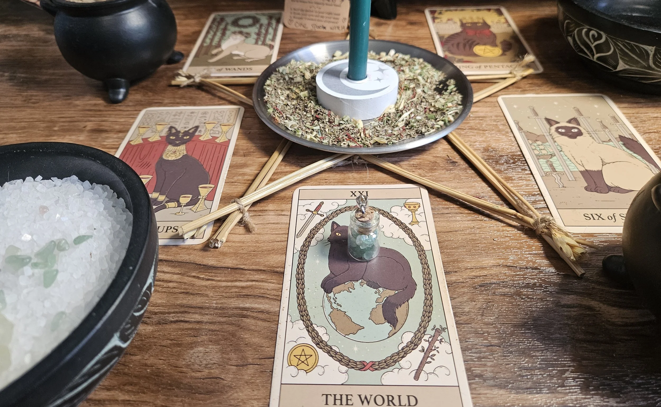 A table set with playing cards and a lit candle, creating a cozy atmosphere for a game night.