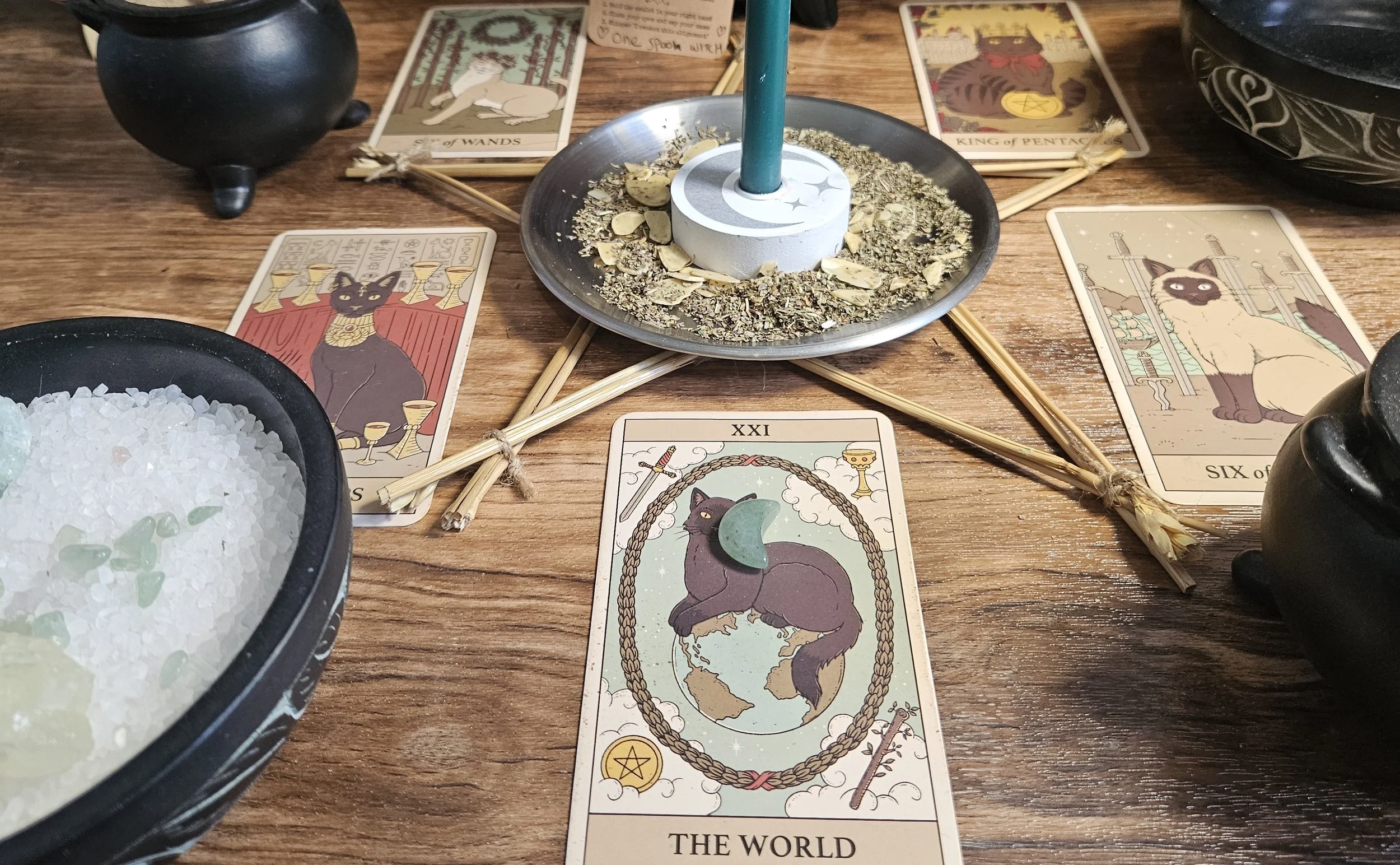 A tarot card spread featuring the World card, symbolizing completion, fulfillment, and harmony in life's journey. (Copy)