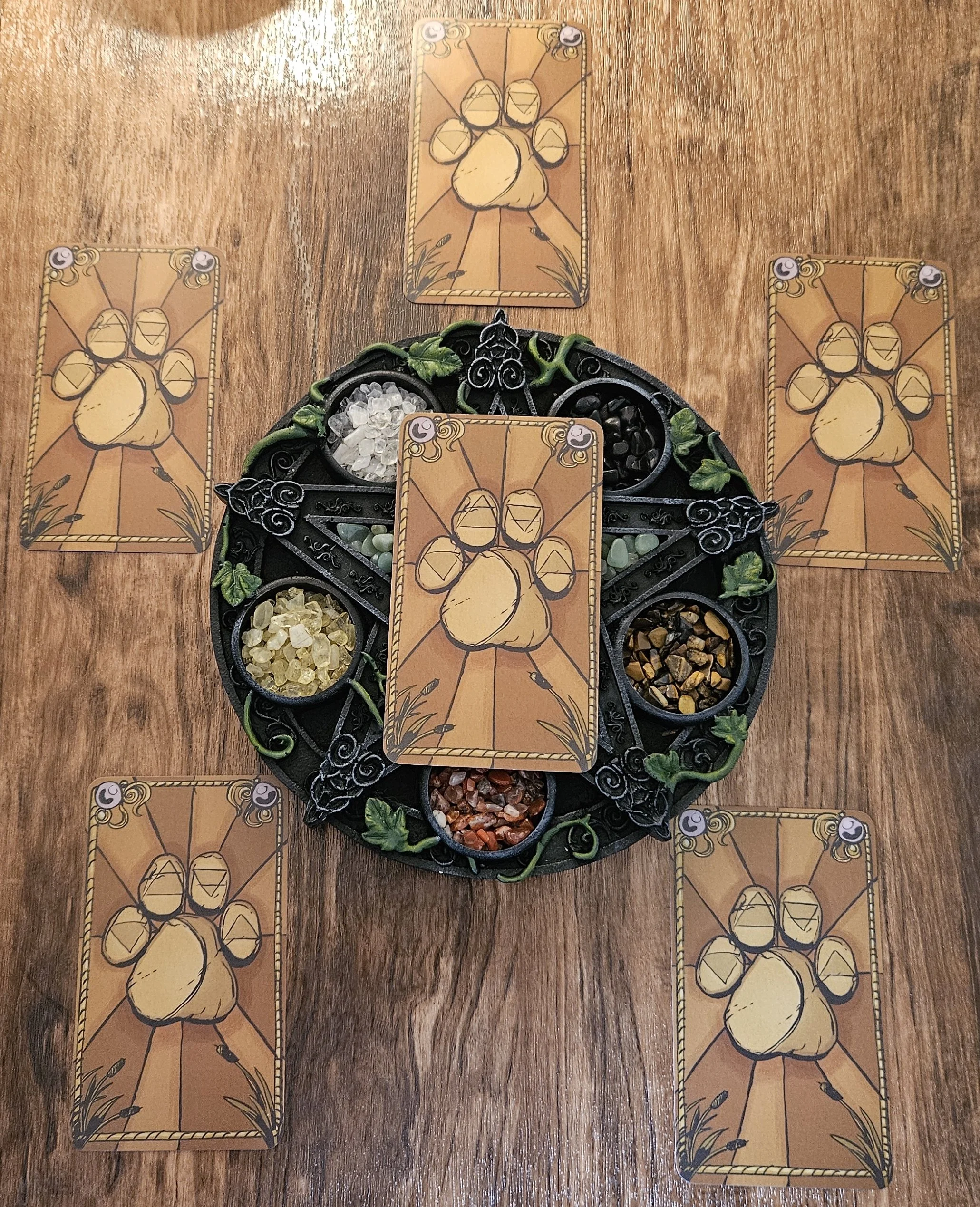 An overhead photo of the soul contract tarot card layout spread across a reading mat with the card backs facing up before the reveal.