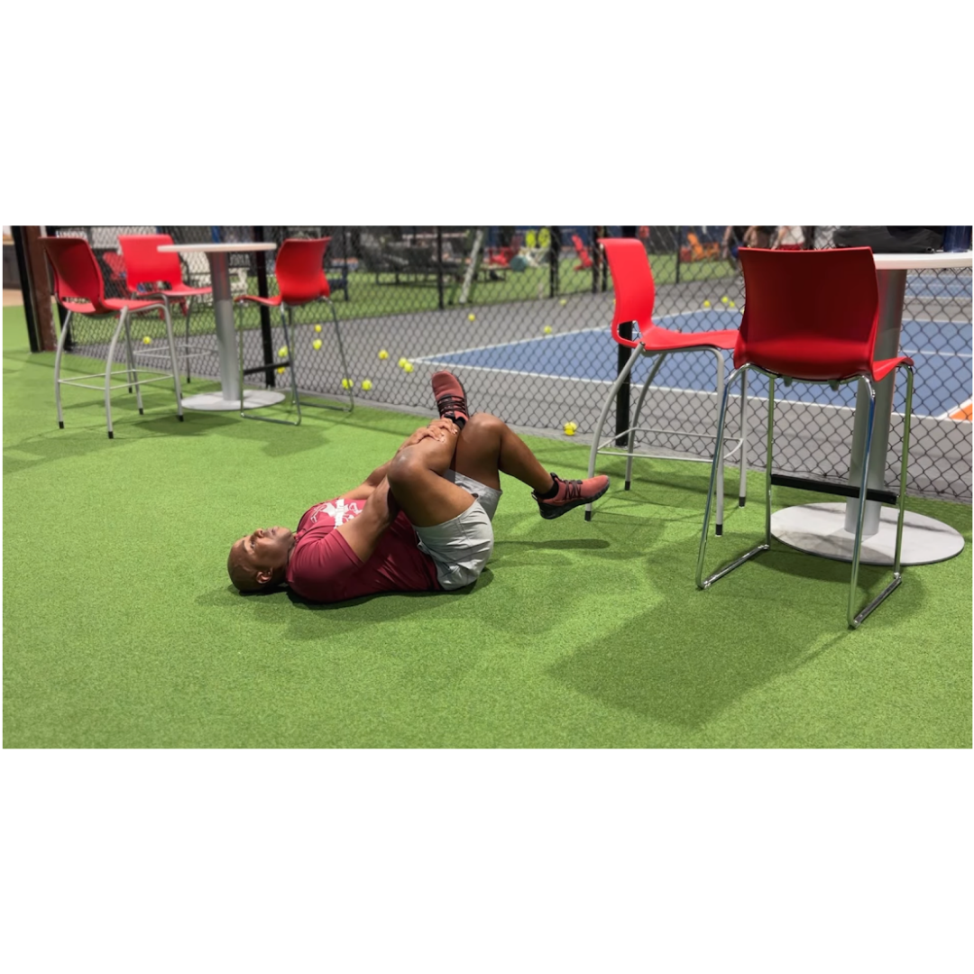 Coach performing post-workout stretching after a pickleball session to improve recovery, flexibility, and reduce muscle soreness.