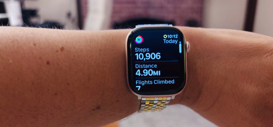 Apple Watch activity tracker displaying a daily step count of 10,000 steps.