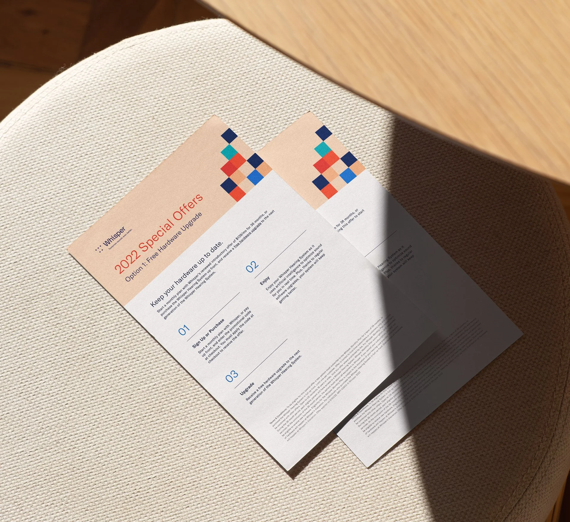 Promotional flyers placed on a stool.