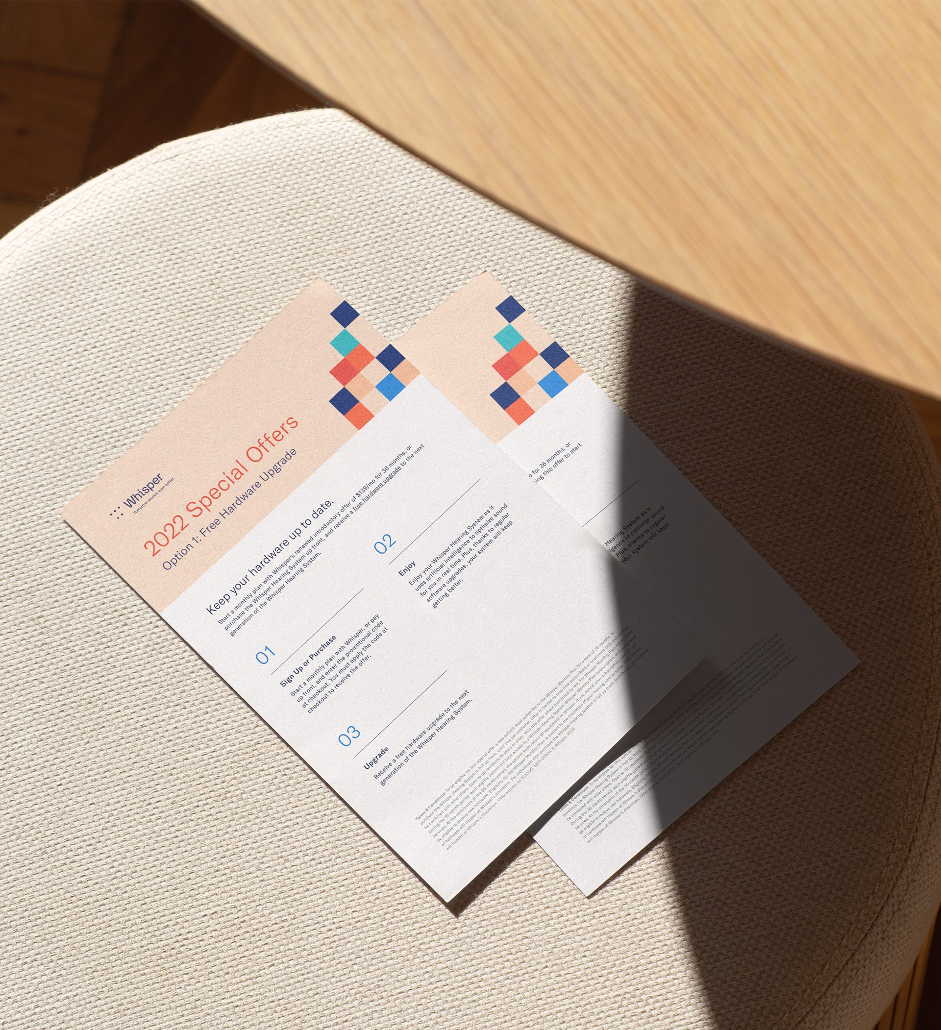 Promotional flyers on a stool.