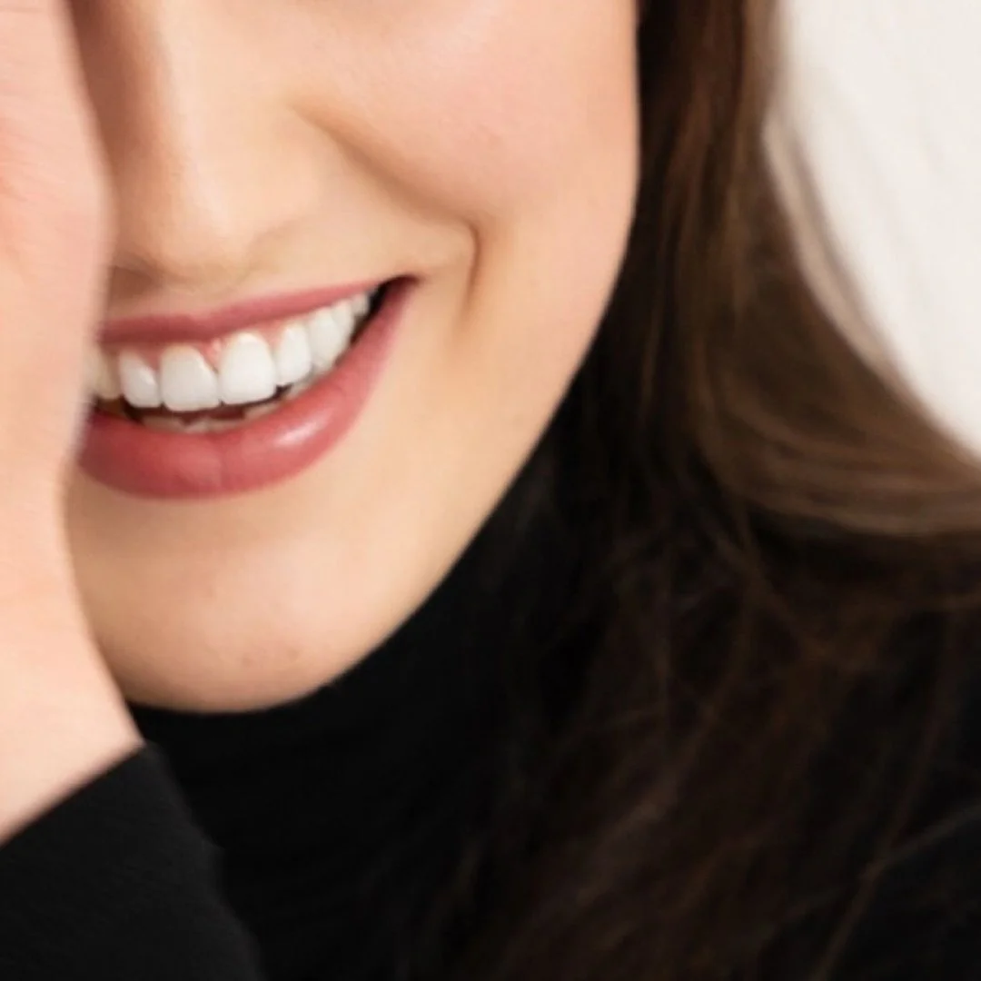 Close up image of a woman's smile. 