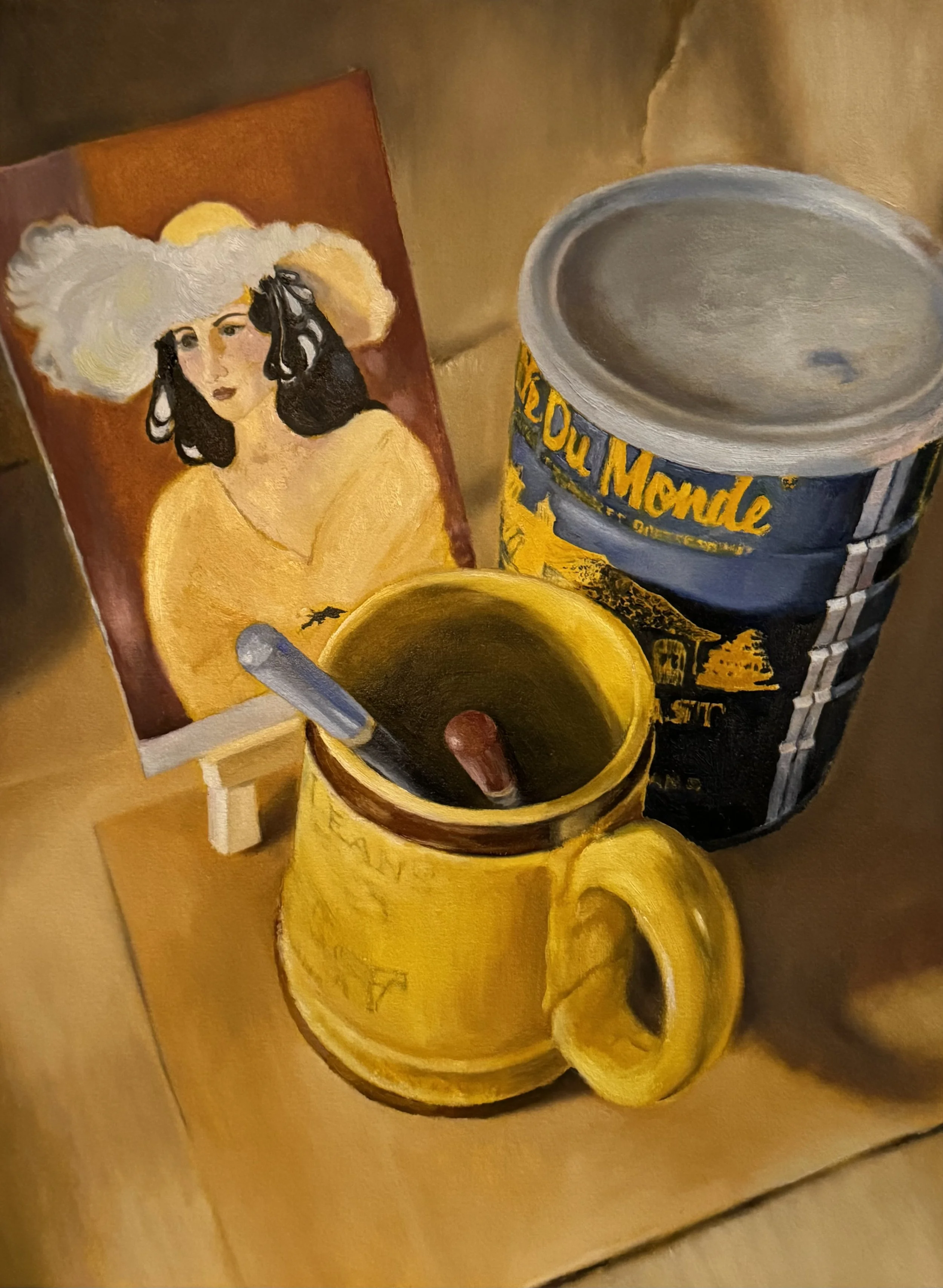 A still life of a faded Matisse post card on a small easel, a vintage Cafe du Monde coffee mug holding a red and a blue pencil, symbolizing politics along with a Cafe du Monde coffee can that has been repurposed for art paint thinner.