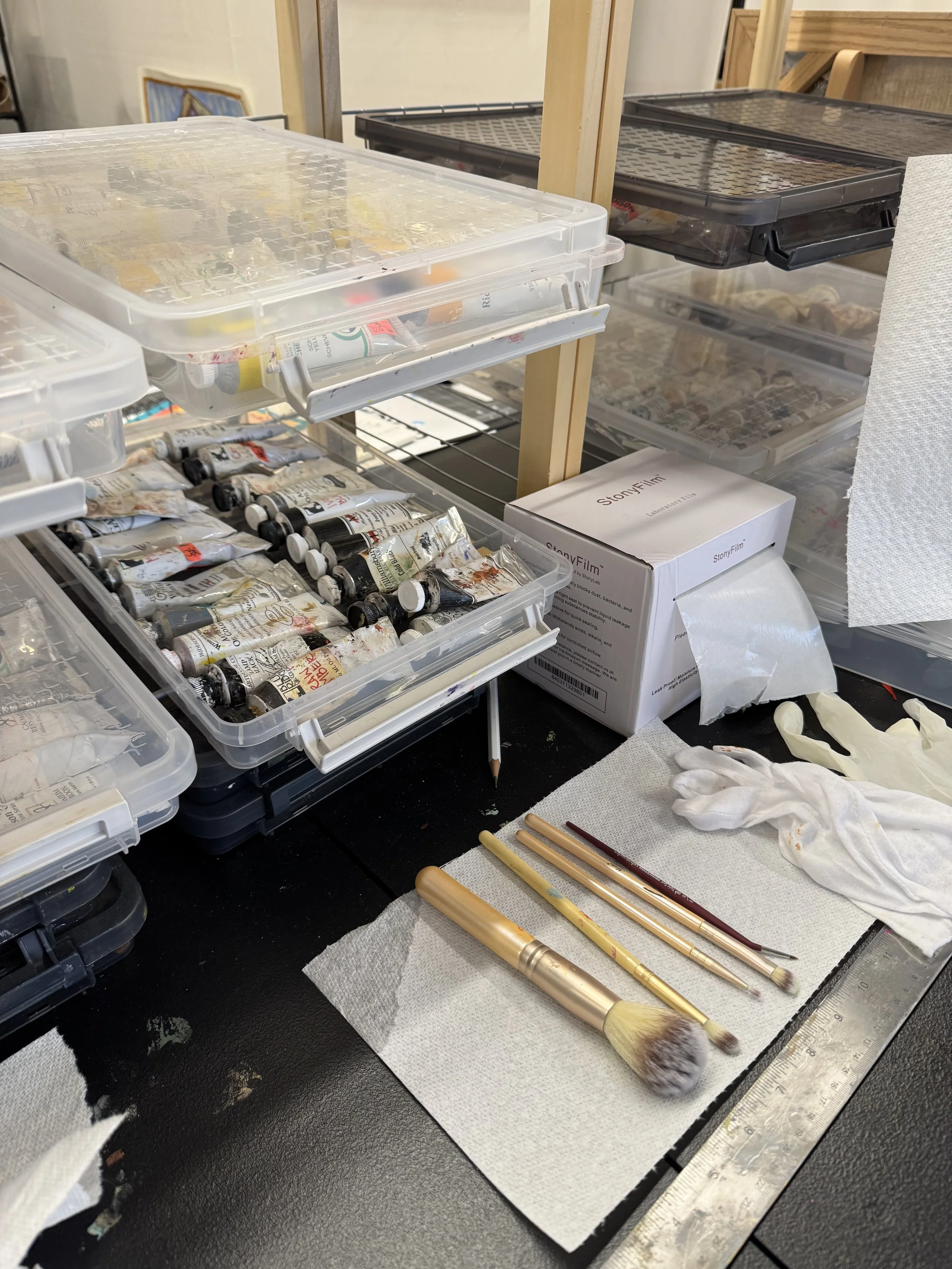 Old shoe racks now hold a serious oil paint investment.