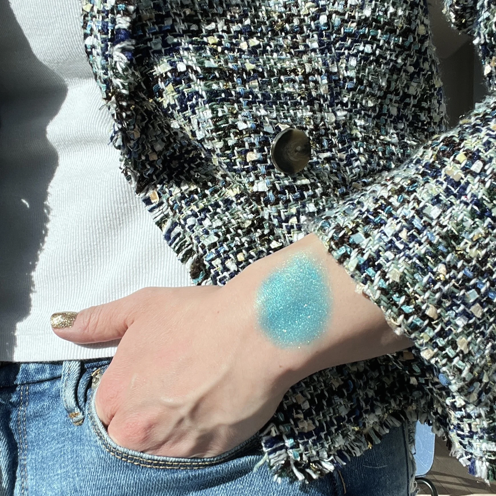 High-pigment blue metallic eyeshadow named Breathtaking Glow swatched on forearm.