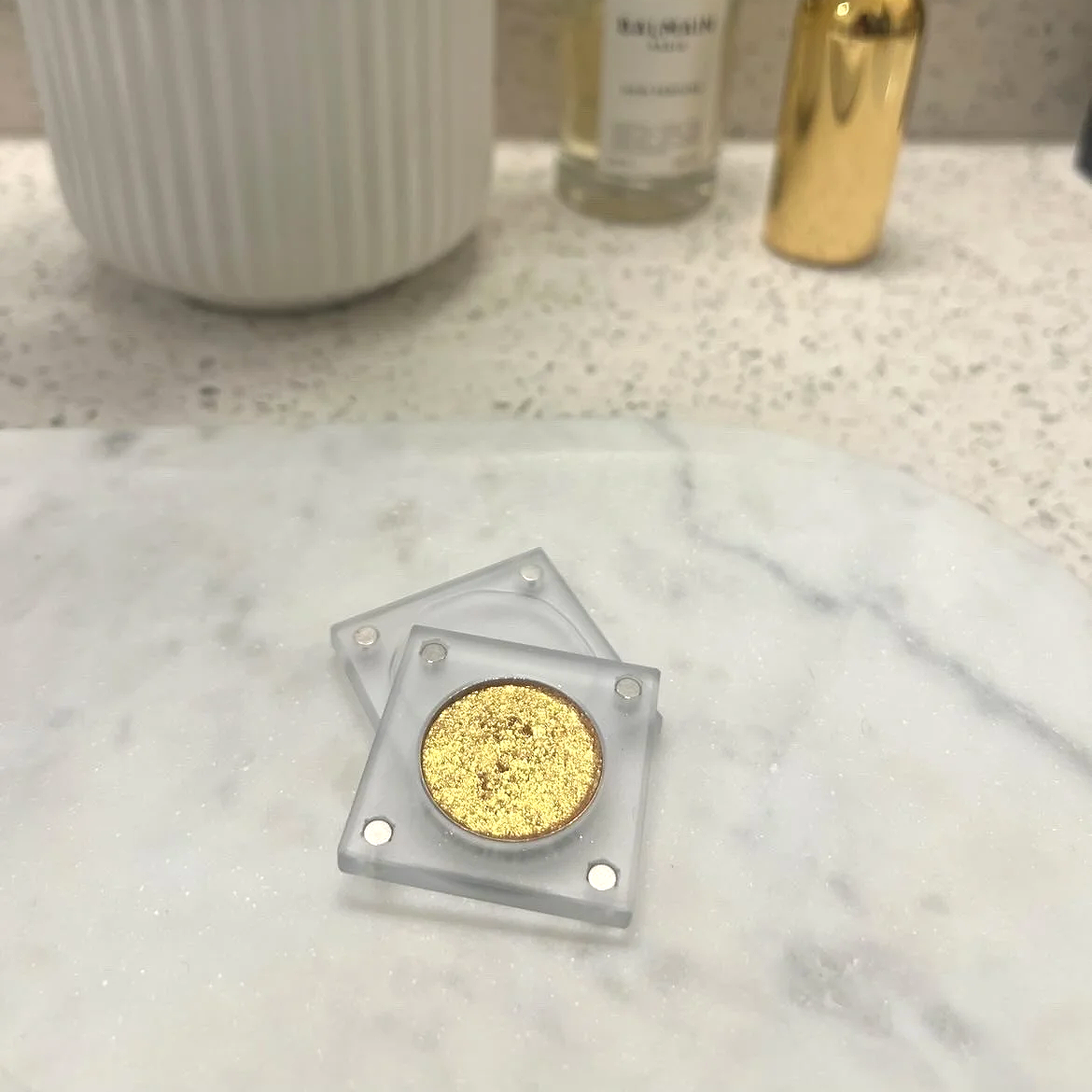 High-pigment golden-orange metallic eyeshadow named Radiant 21st in transparent magnetic case by The Imperfectionist.