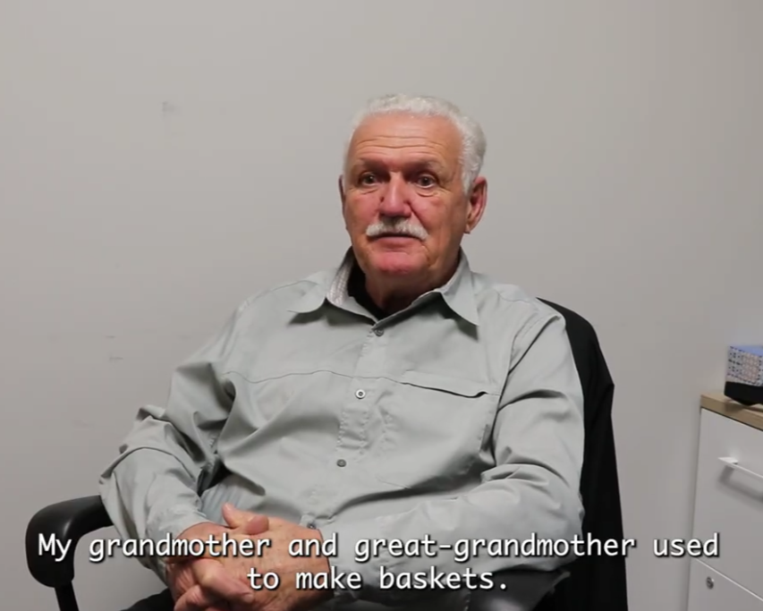 A still image from a video showing Abenaki elder Michele Durand speaking about his family history of land stewardship, food traditions, and medicinal plants