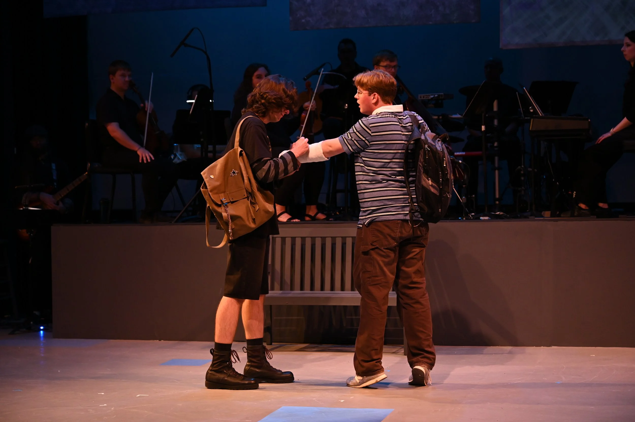 Connor Murphy (Played by Nick Fowler) signing Evan Hansen's (Played by Brady Green) cast. This cast was specially made by our props designer, Samantha Jemmot, to fit Brady's arm and through trial and error was able to remove the signature each night 