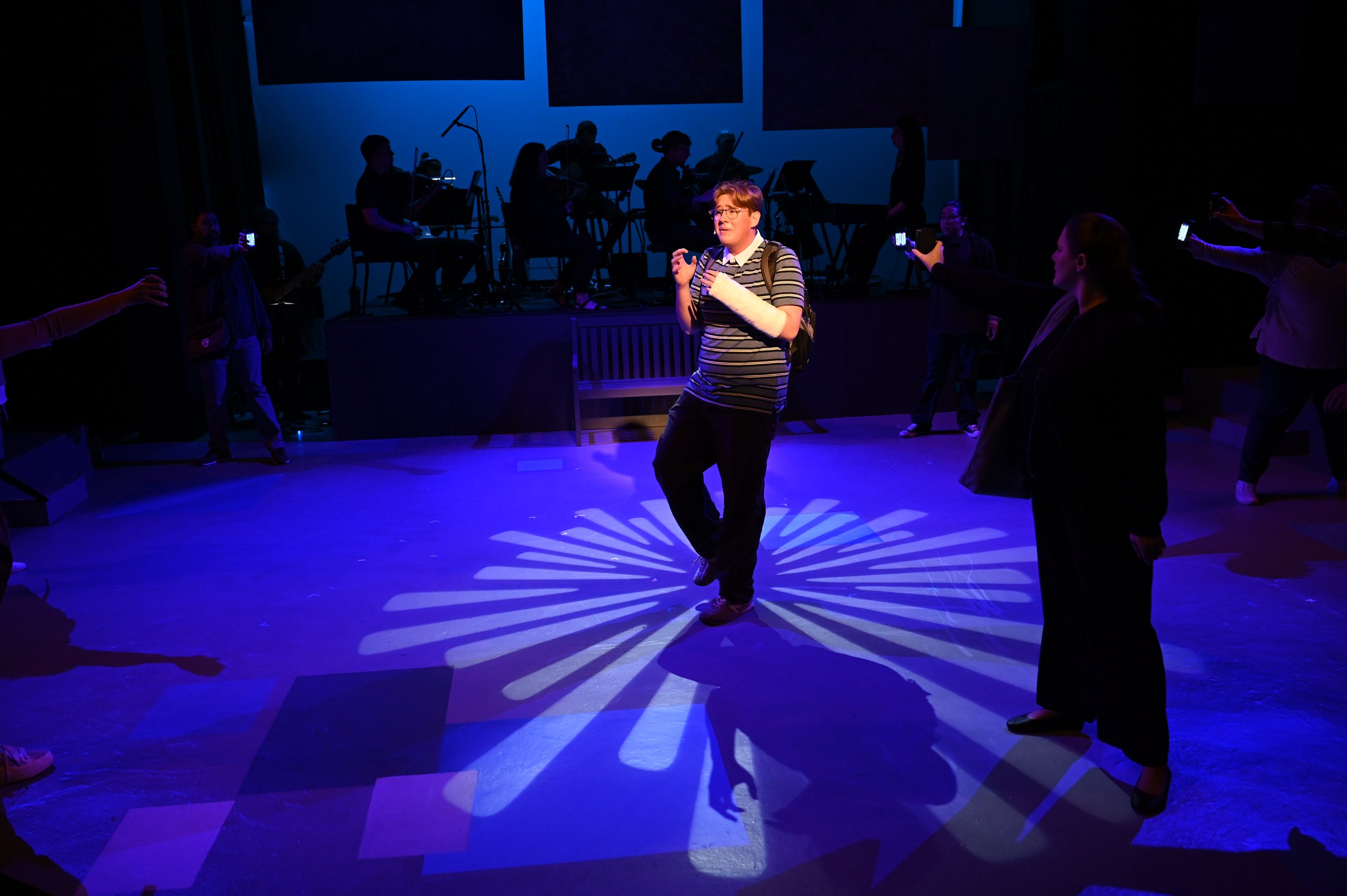 Full Company in "Waving Through a Window" including light up phones created for the production. ASM Benji Shuba controlled the lights in the phones offstage as I called from the sheet music.