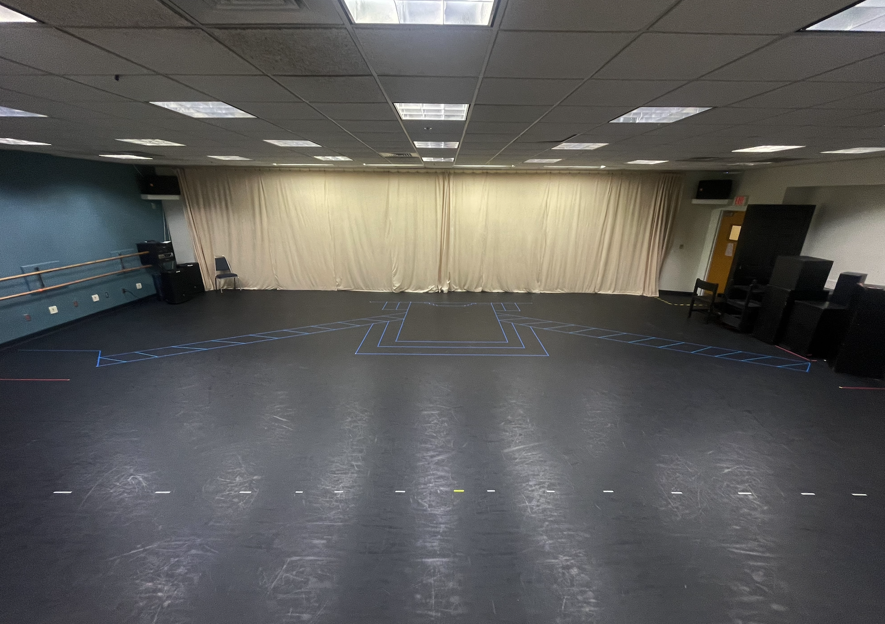 Taped floor of the set in the rehearsal studio