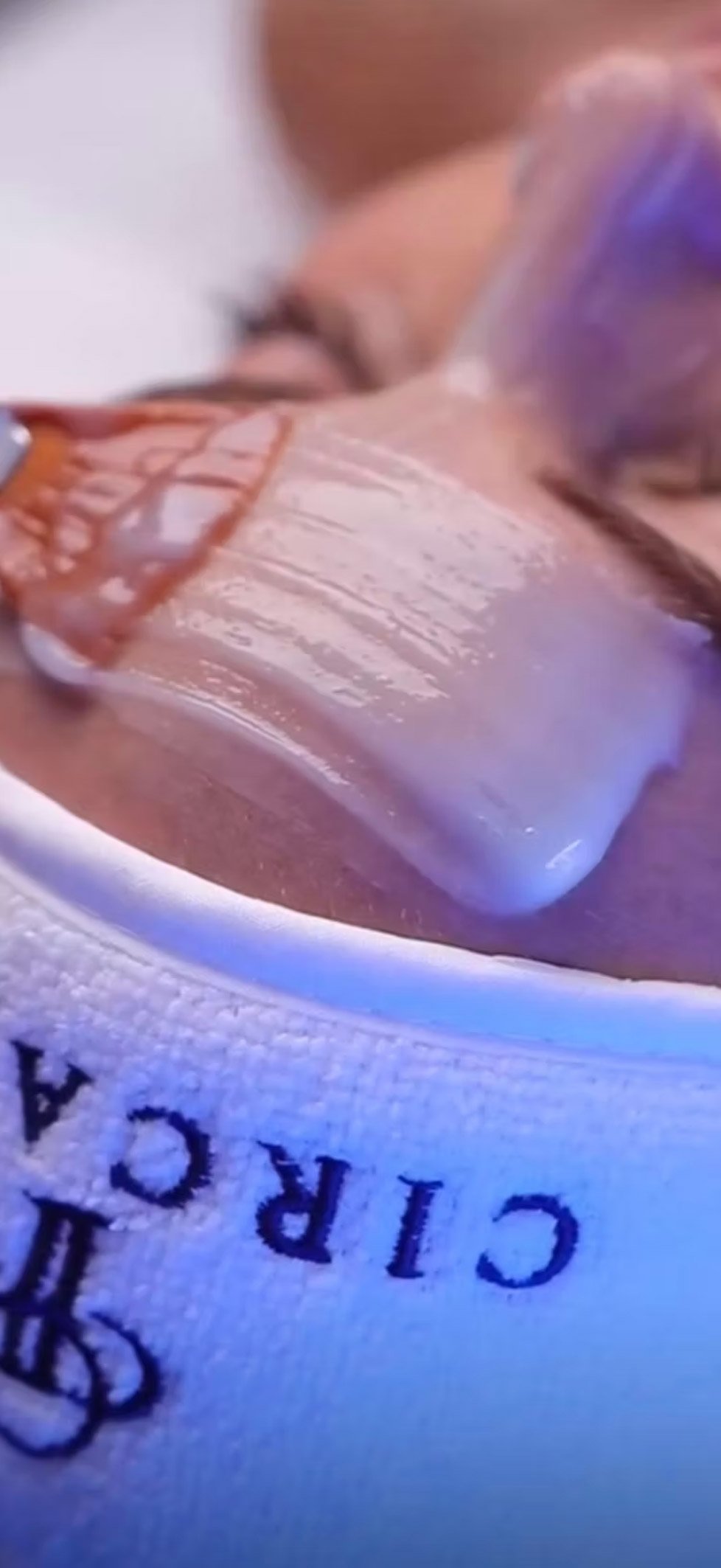 A person with receiving a med spa treatment in a clinical setting.