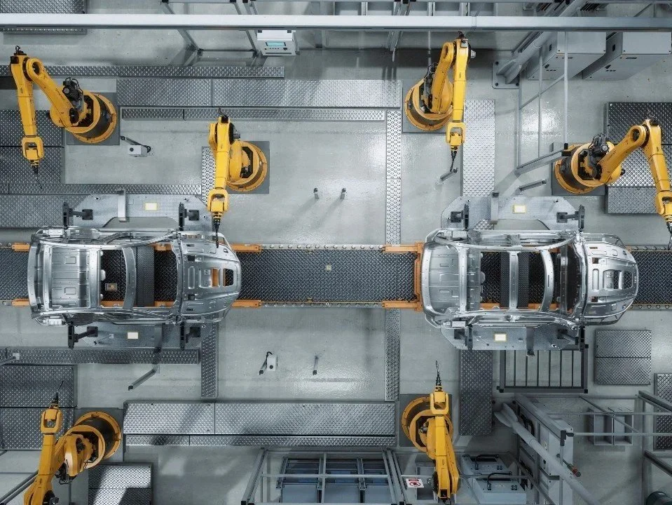 Top-down view of automated assembly line showing optimized vehicle flow and lean manufacturing principles